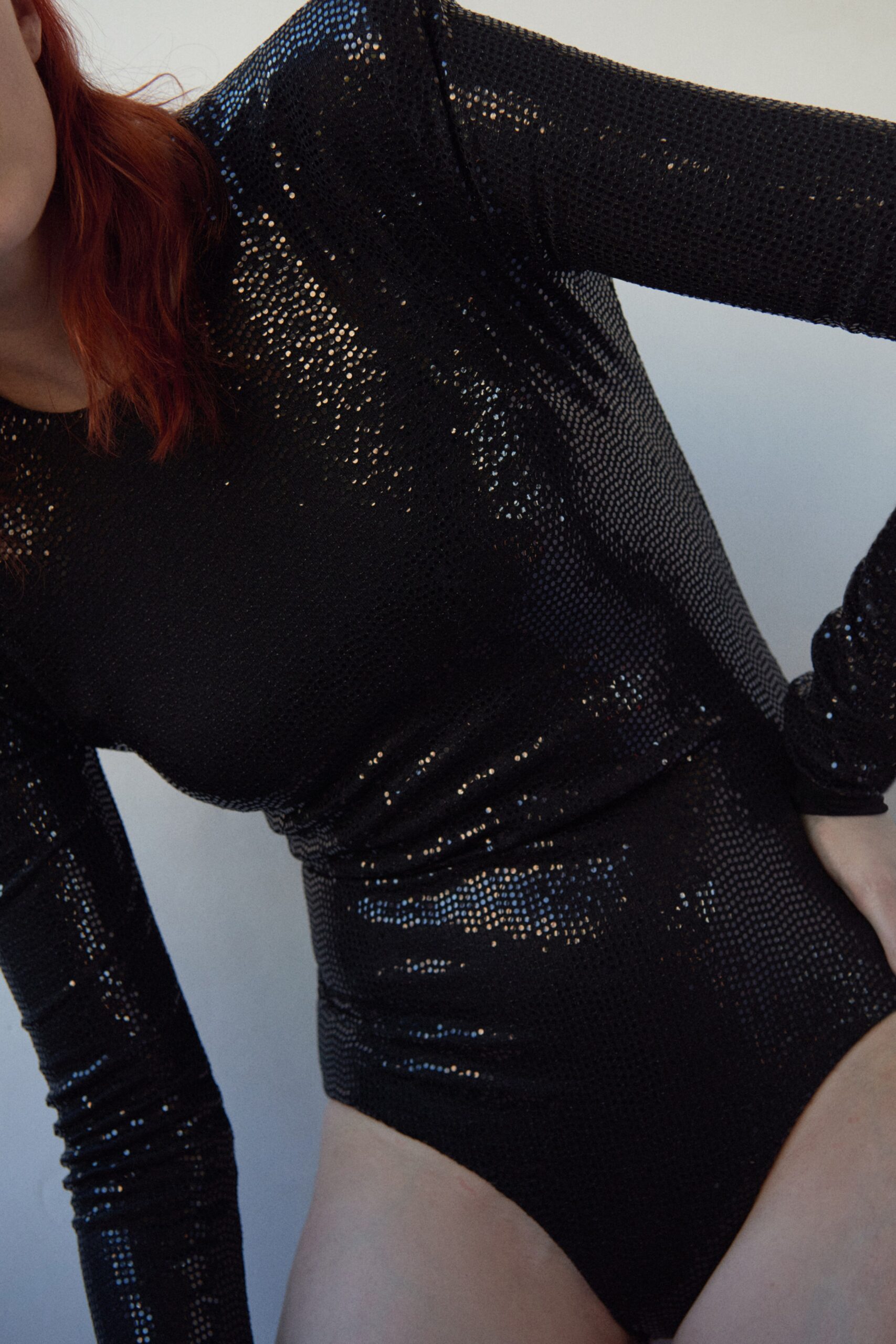 black sequin long-sleeve bodysuit