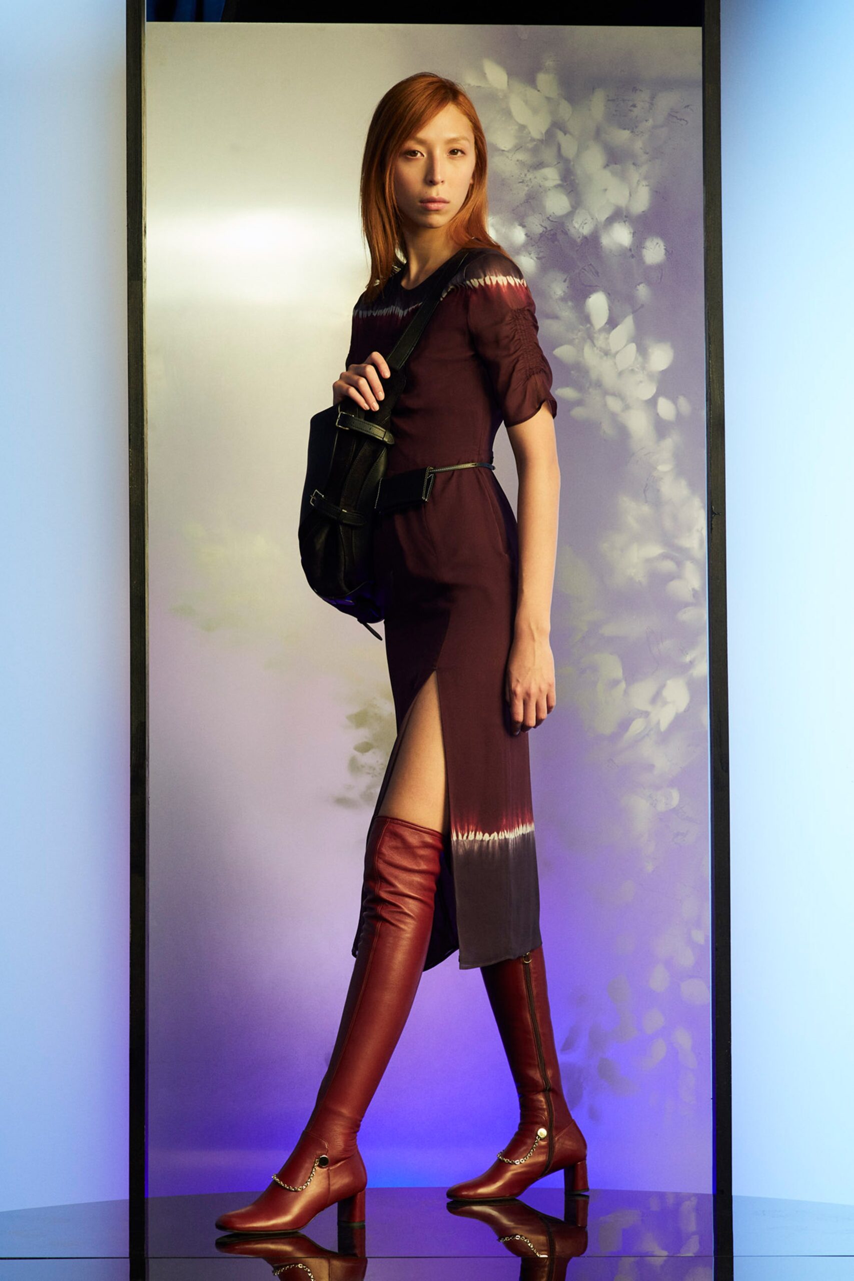 fitted purple midi dress with red boots