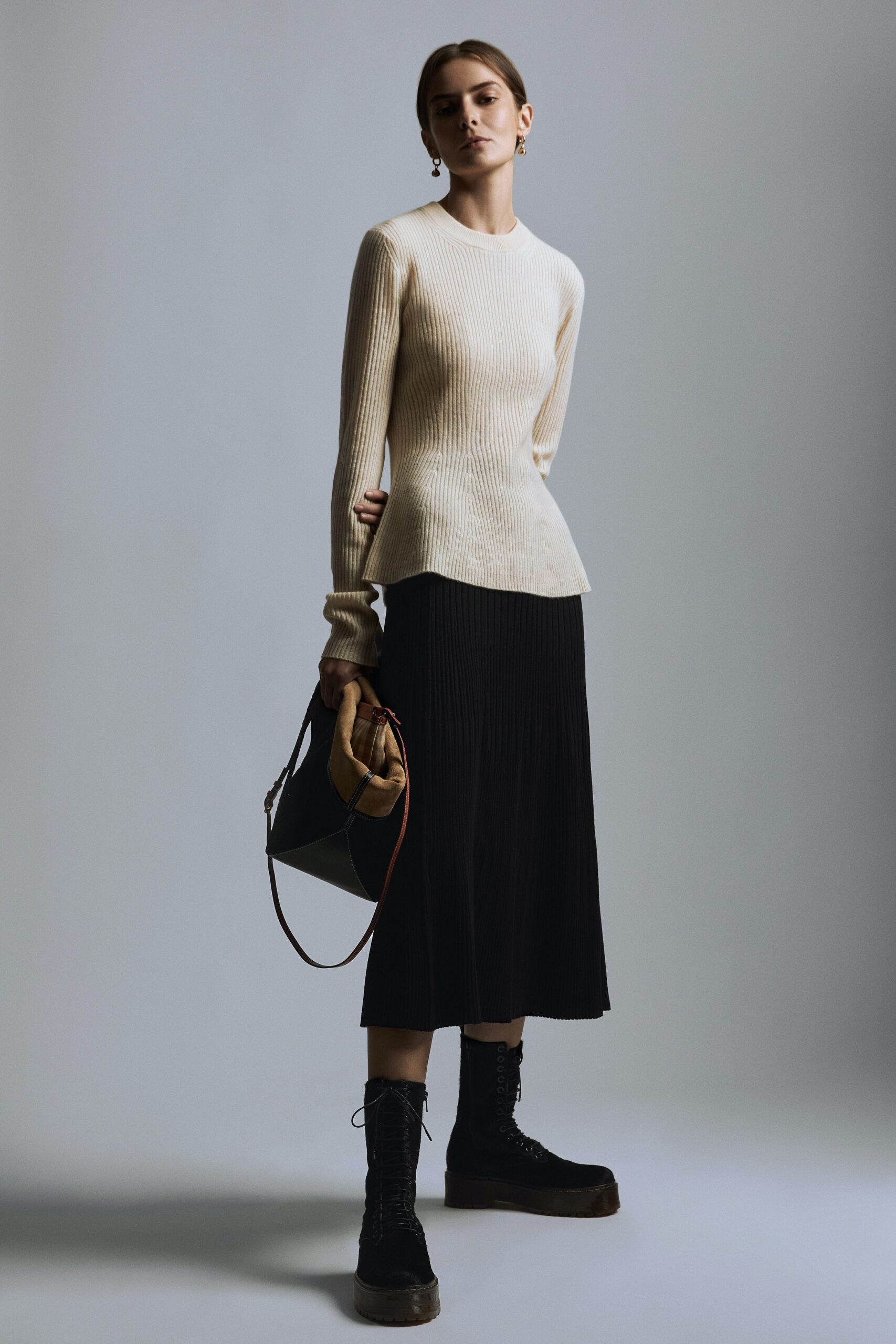 white fitted top black pleated skirt