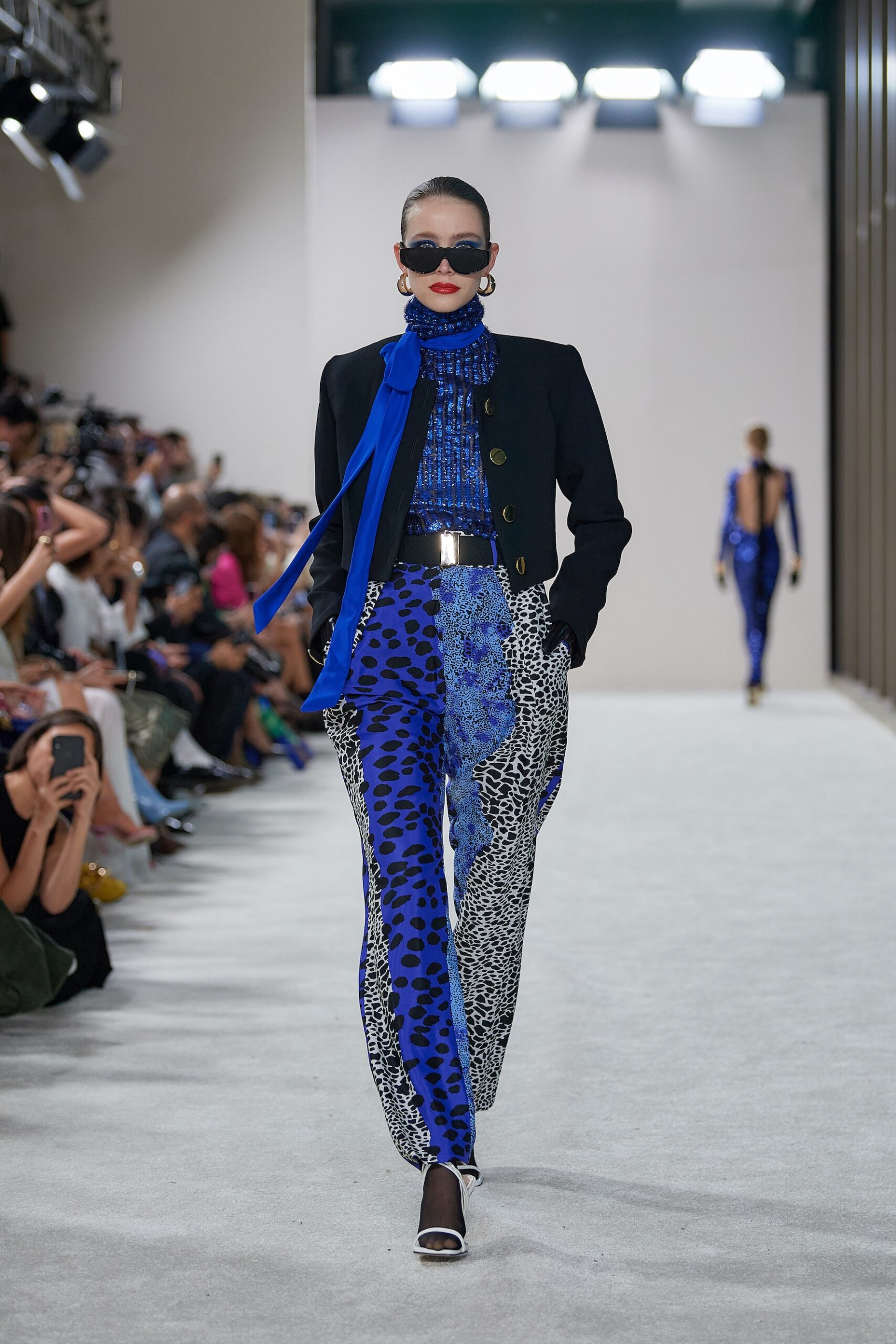black blazer with blue top and printed pants