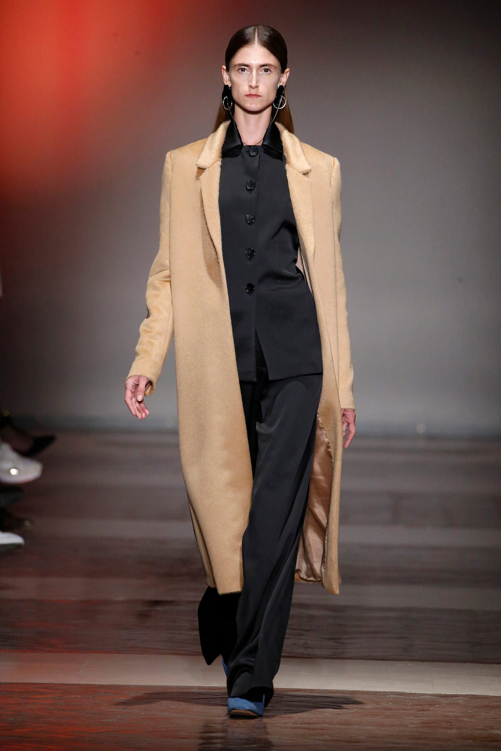 beige wool coat and black suit