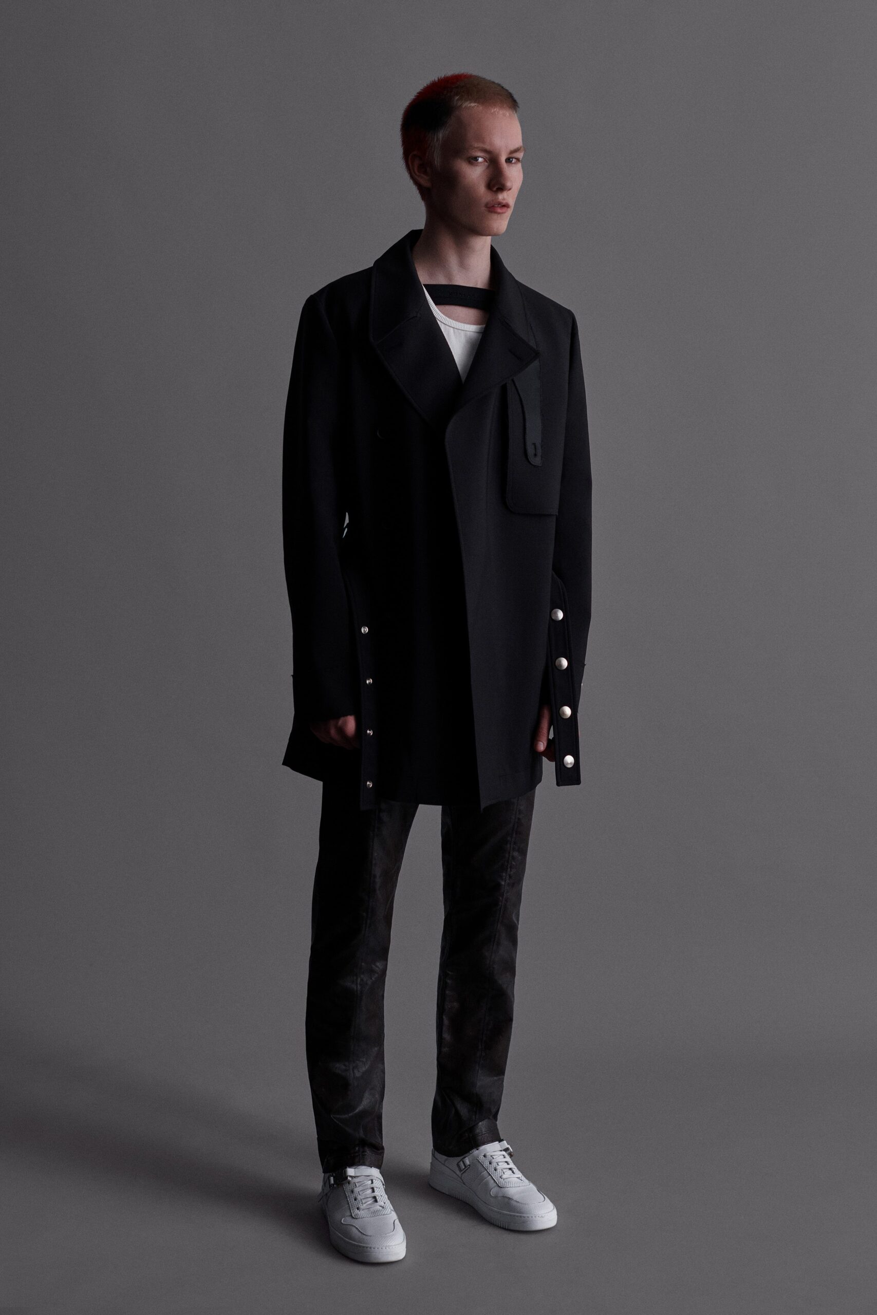 black relaxed coat with gray pants