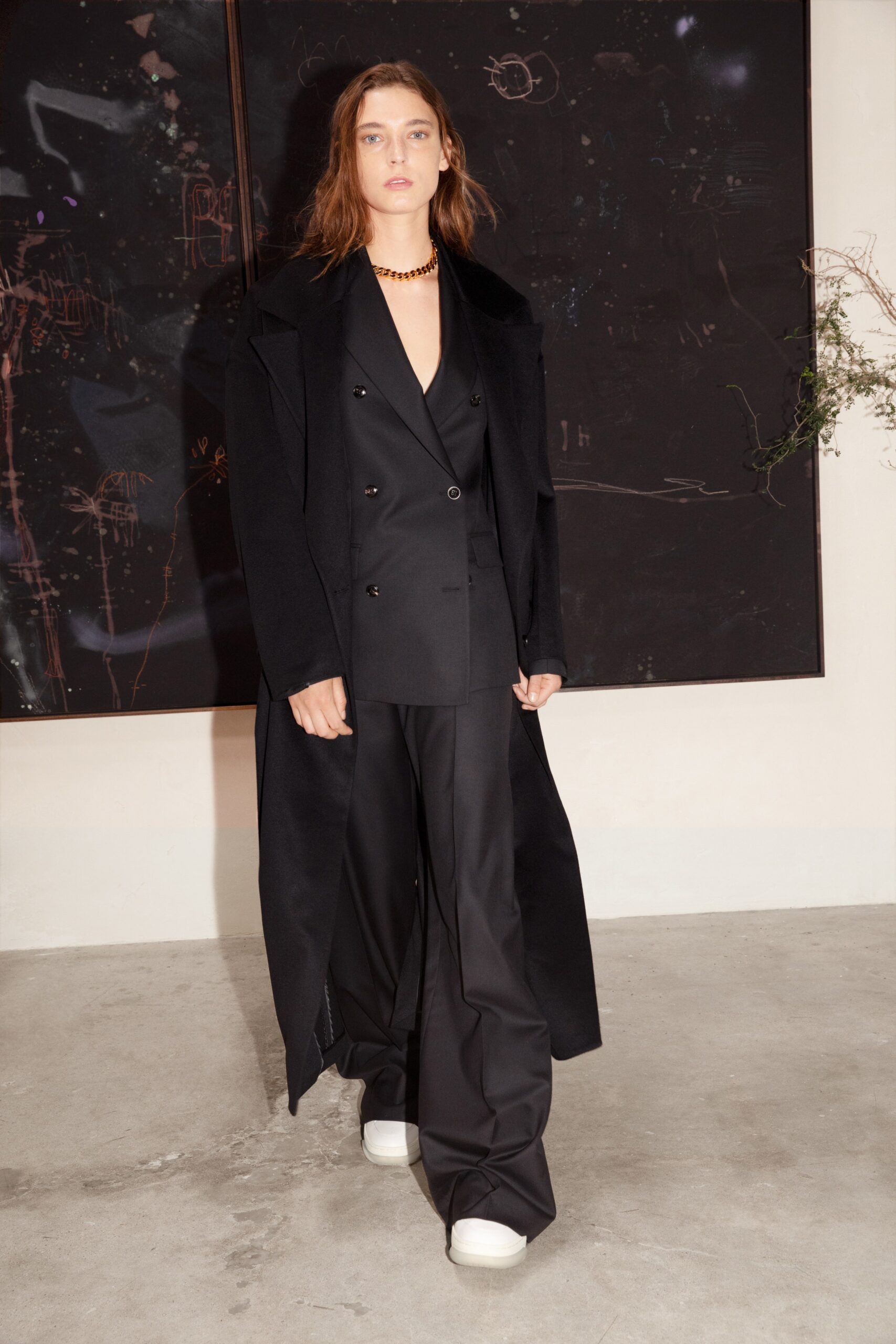 black wool coat and suit with white shoes