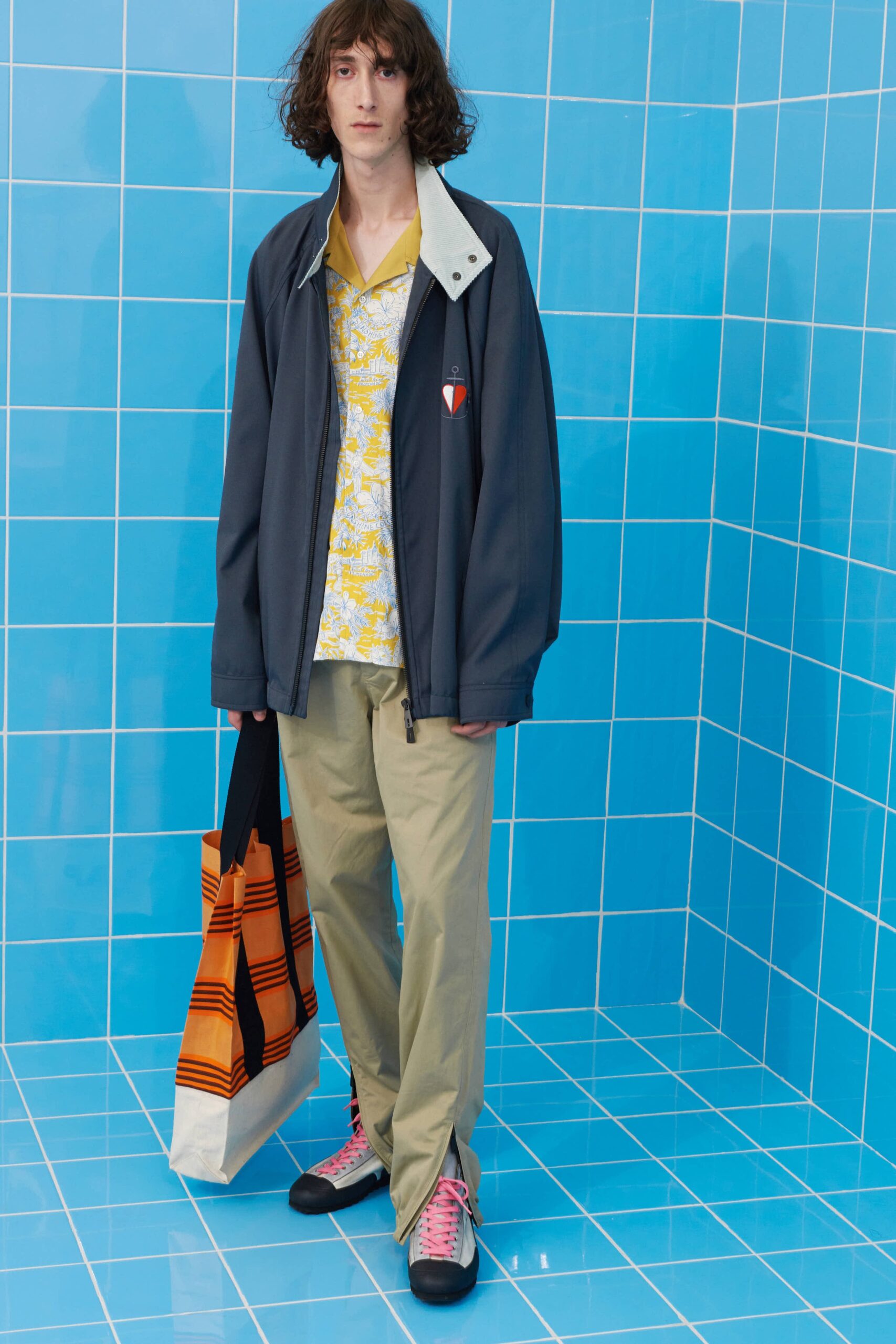 gray jacket yellow shirt beige pants