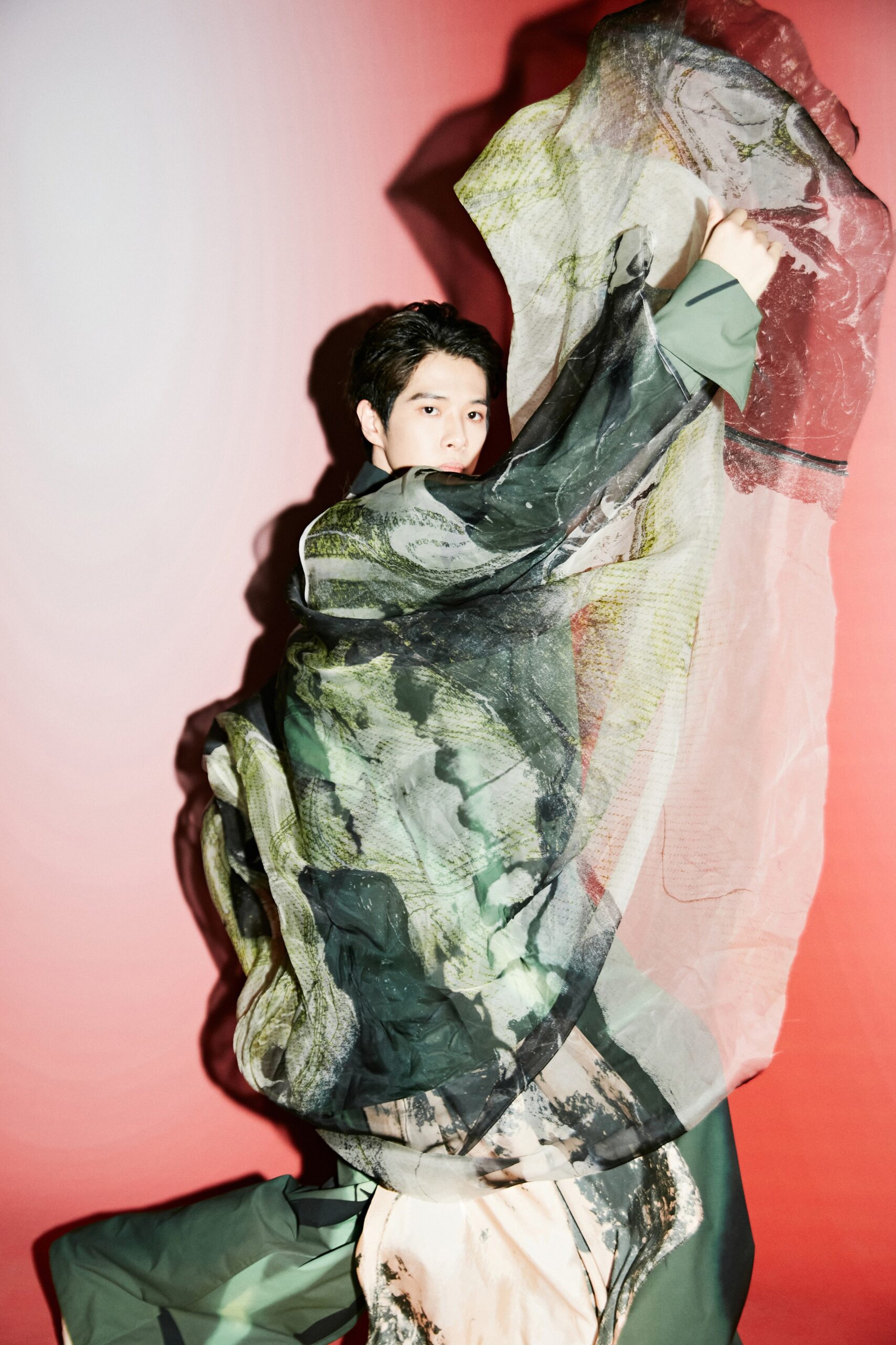 flowing green silk dress with multi-colored cape