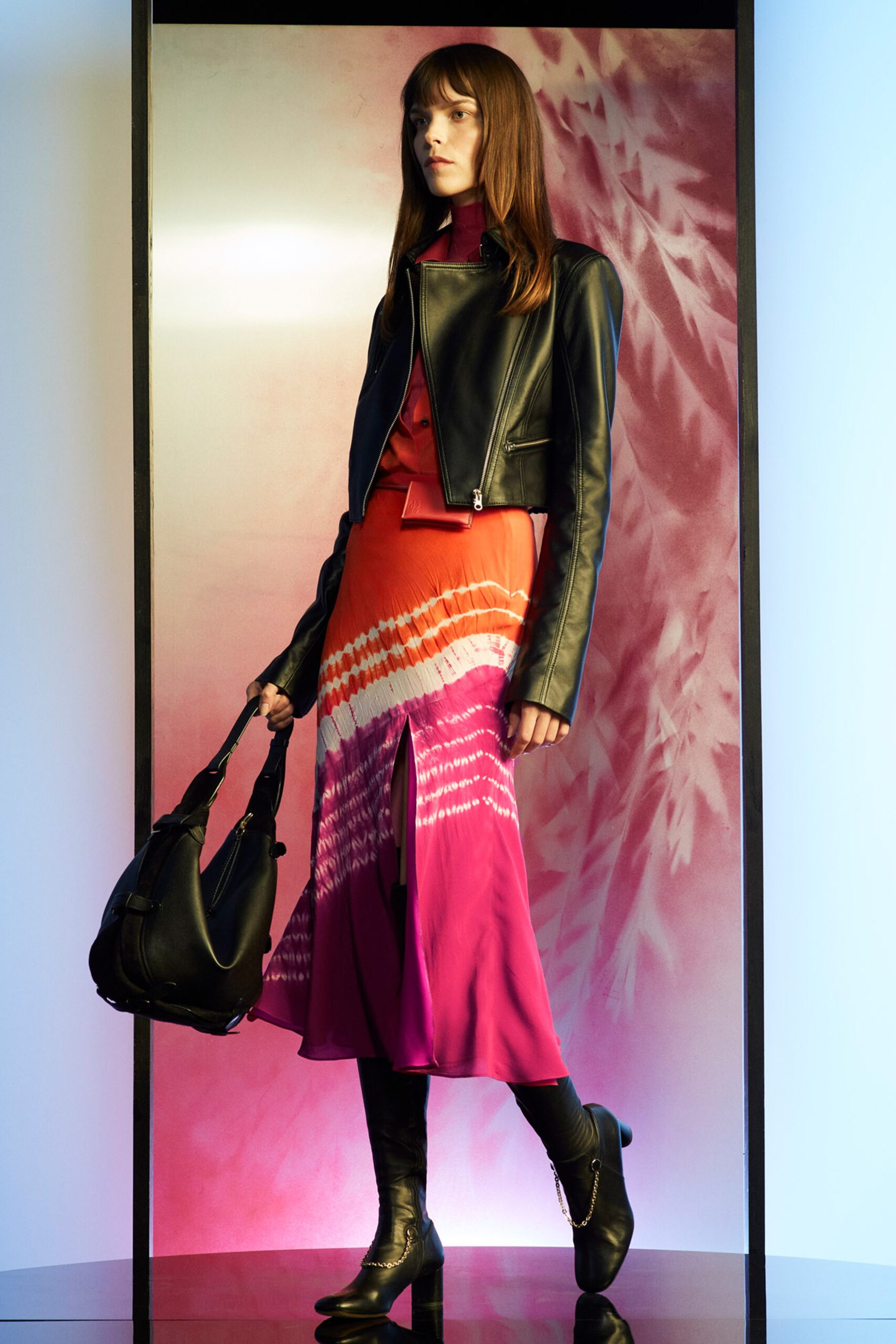 black leather jacket and pink dress