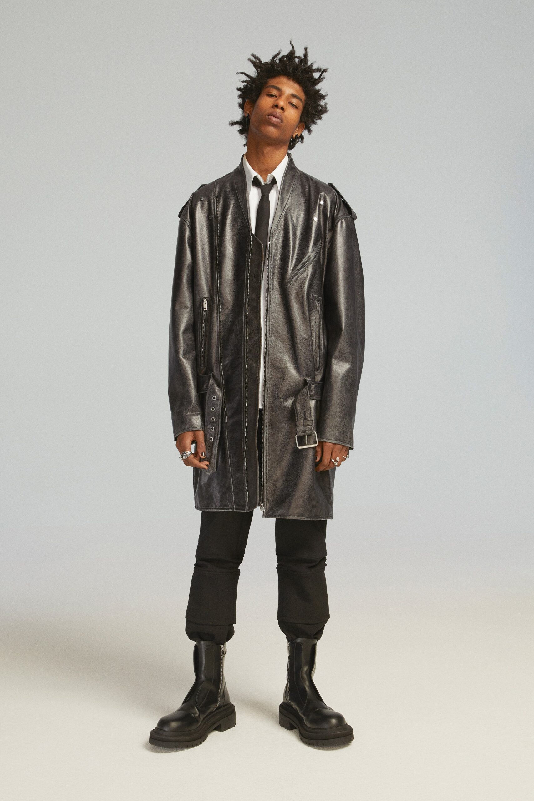 black leather long-sleeve collared oversized zippered pockets coat