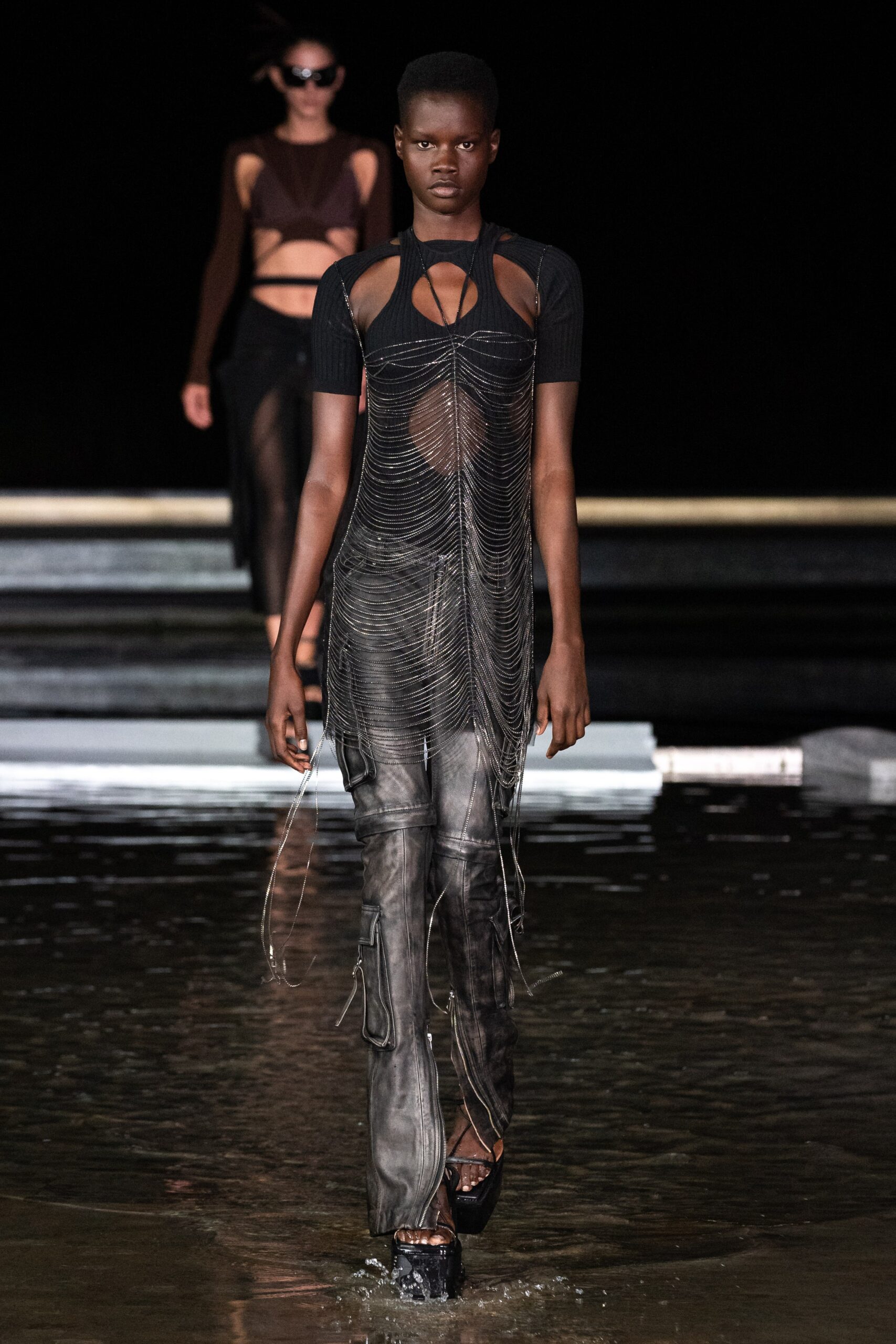 black fitted dress and slim pants