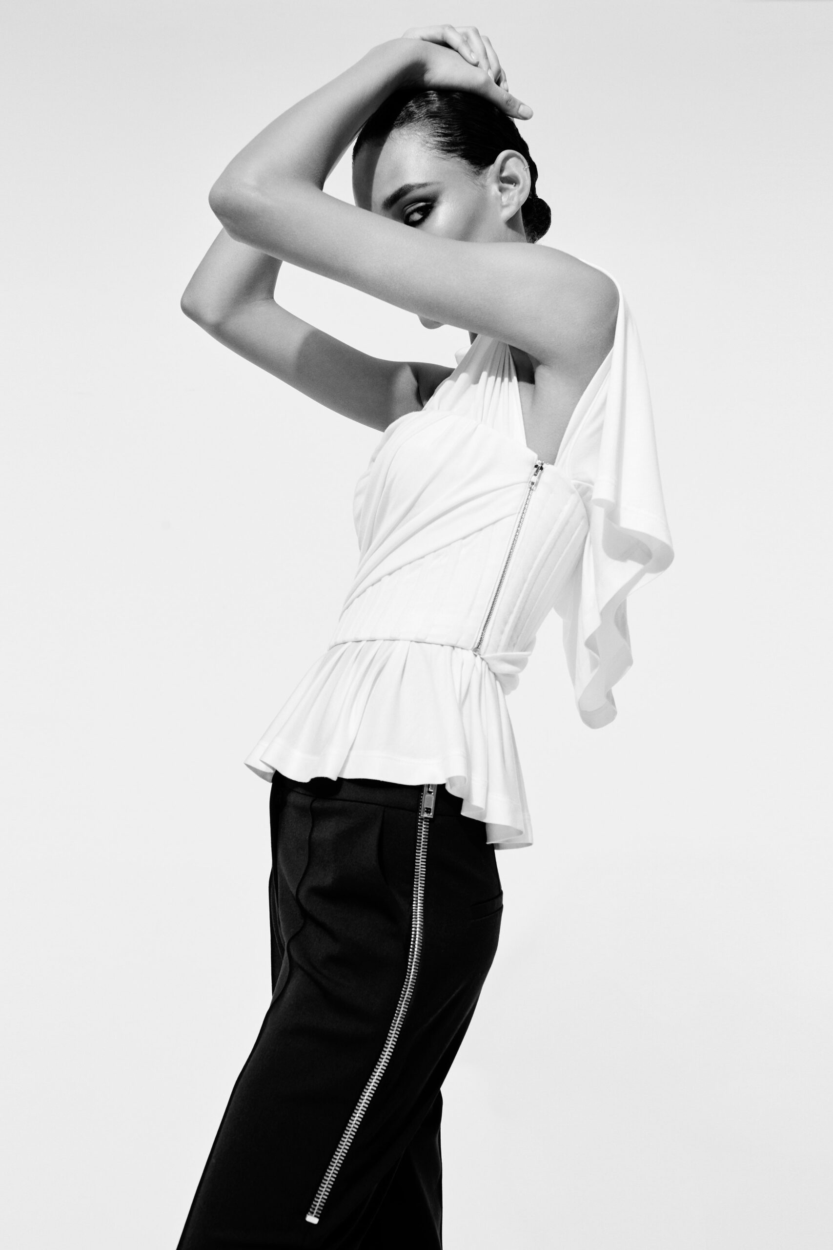 white fitted top and black slim pants