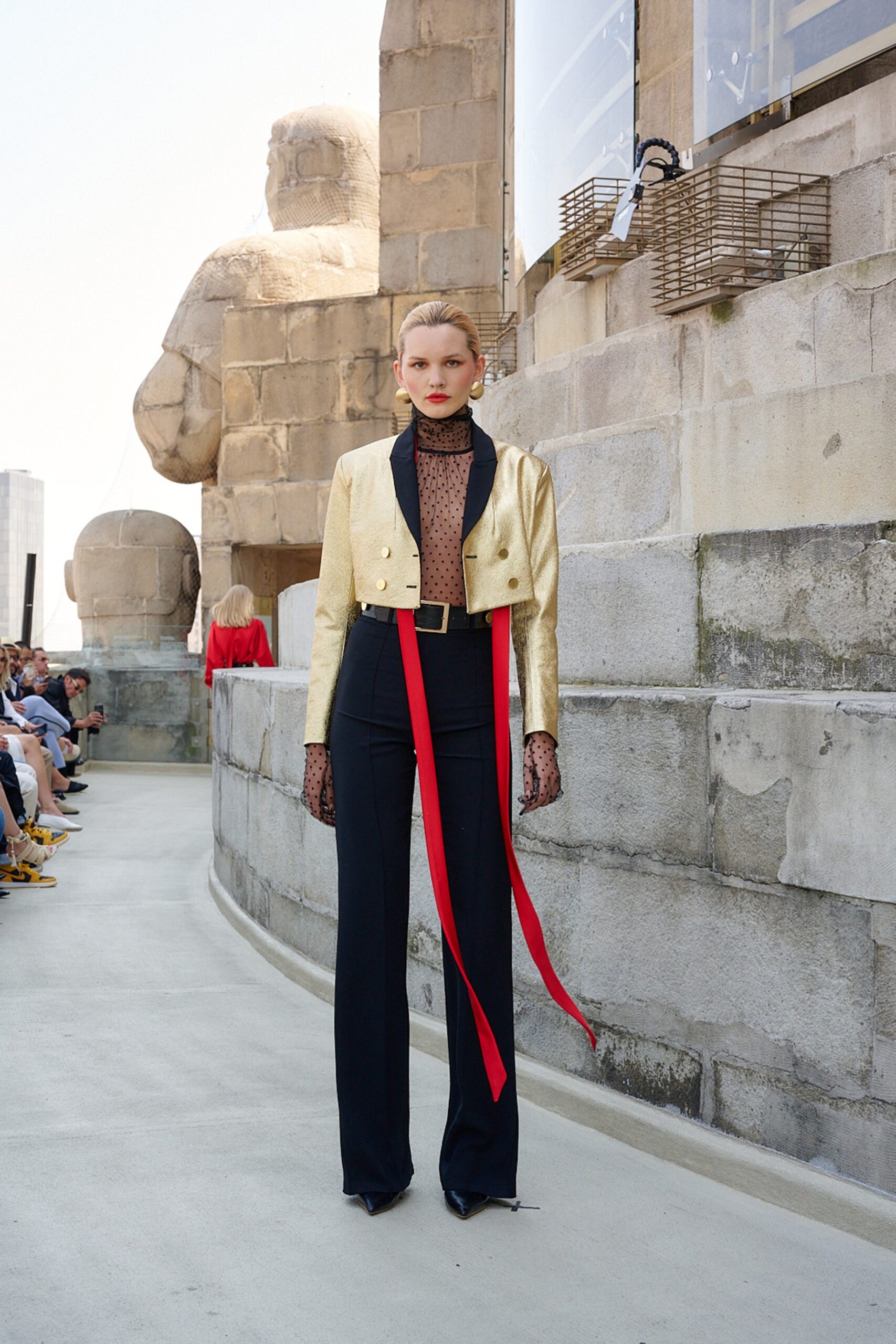gold silk jacket with black pants
