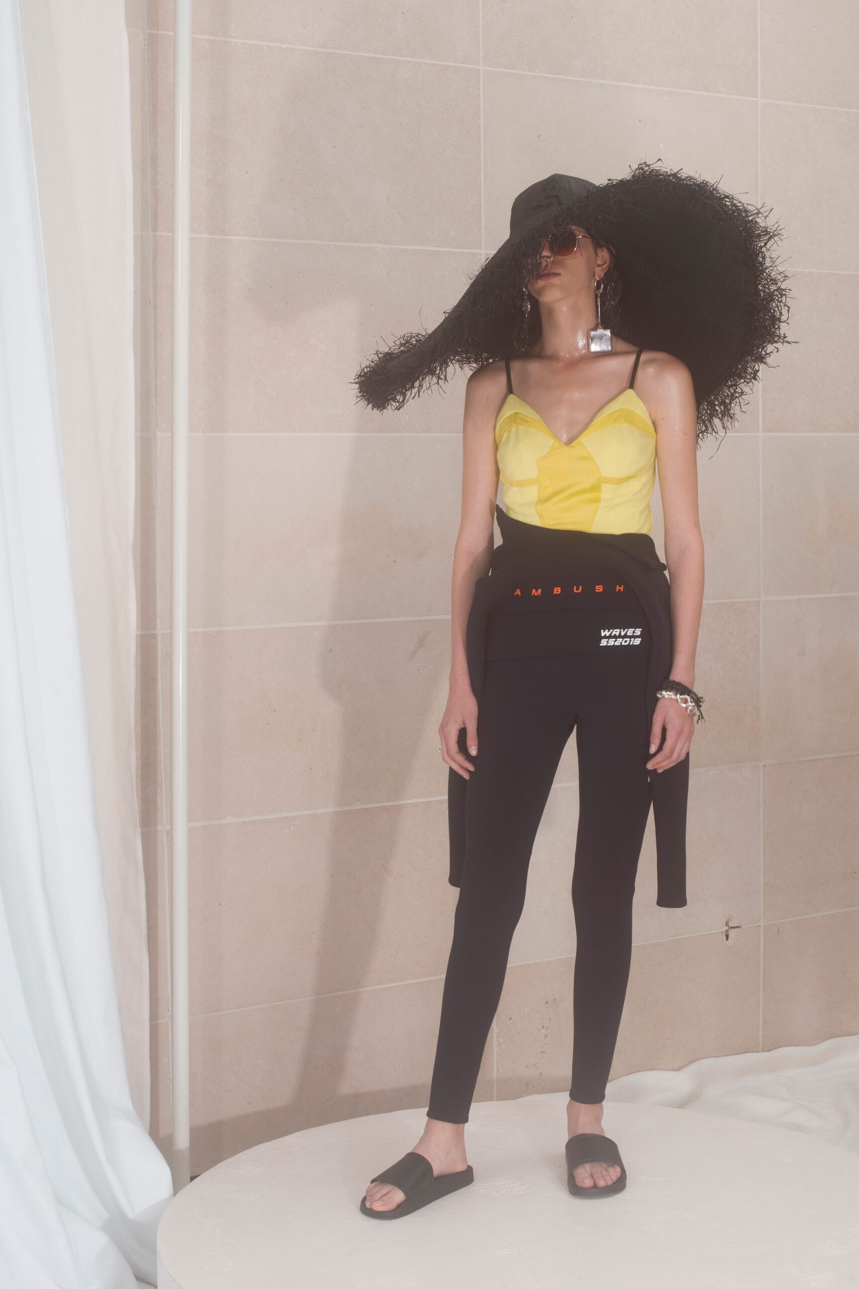 yellow fitted top with black pants