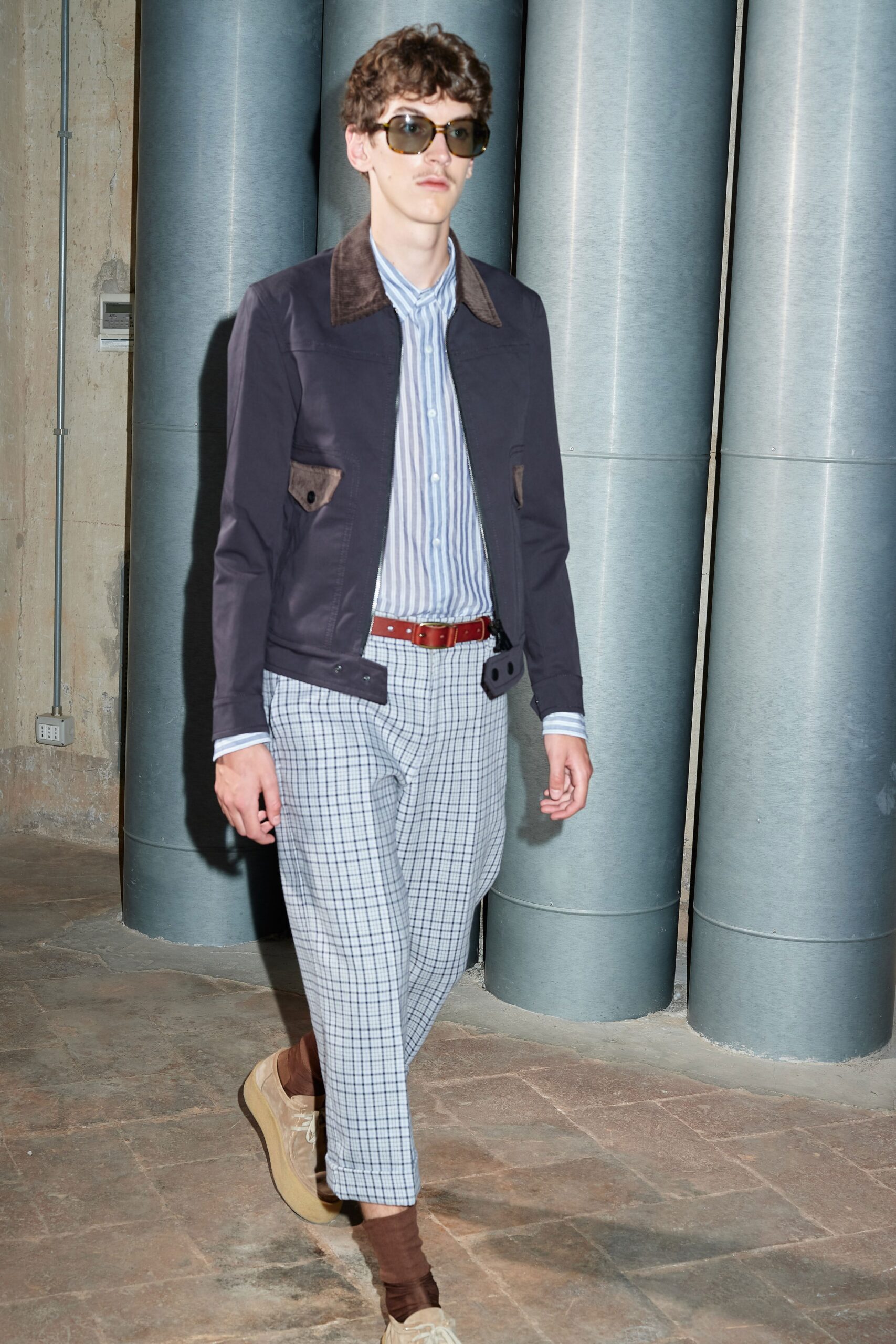 black jacket blue striped shirt