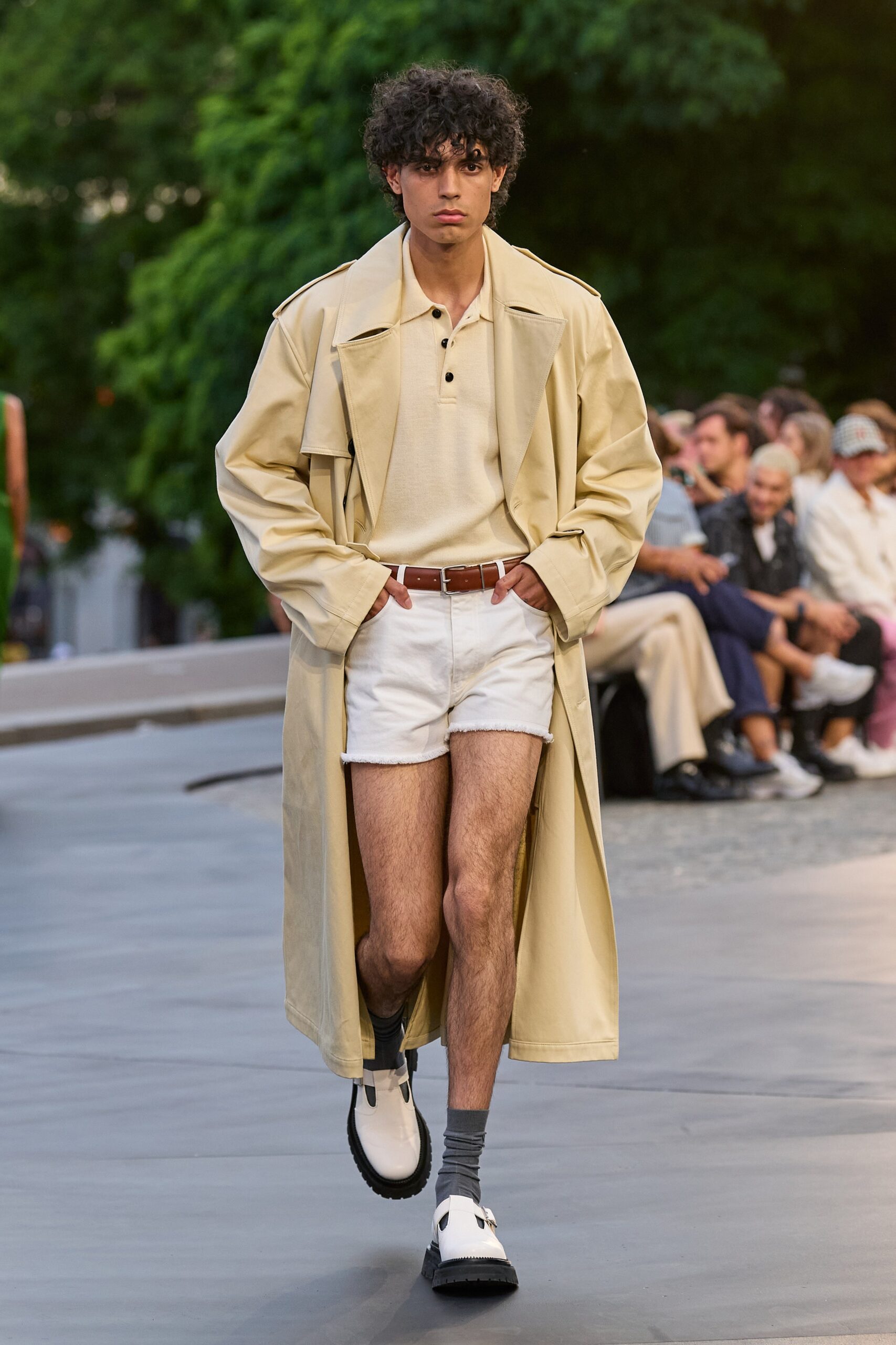 beige trench coat with white shirt and shorts