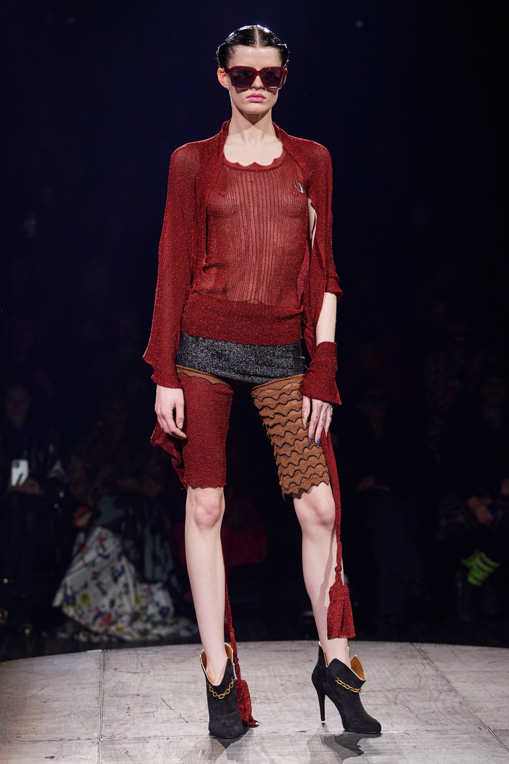 red mesh top with black shorts