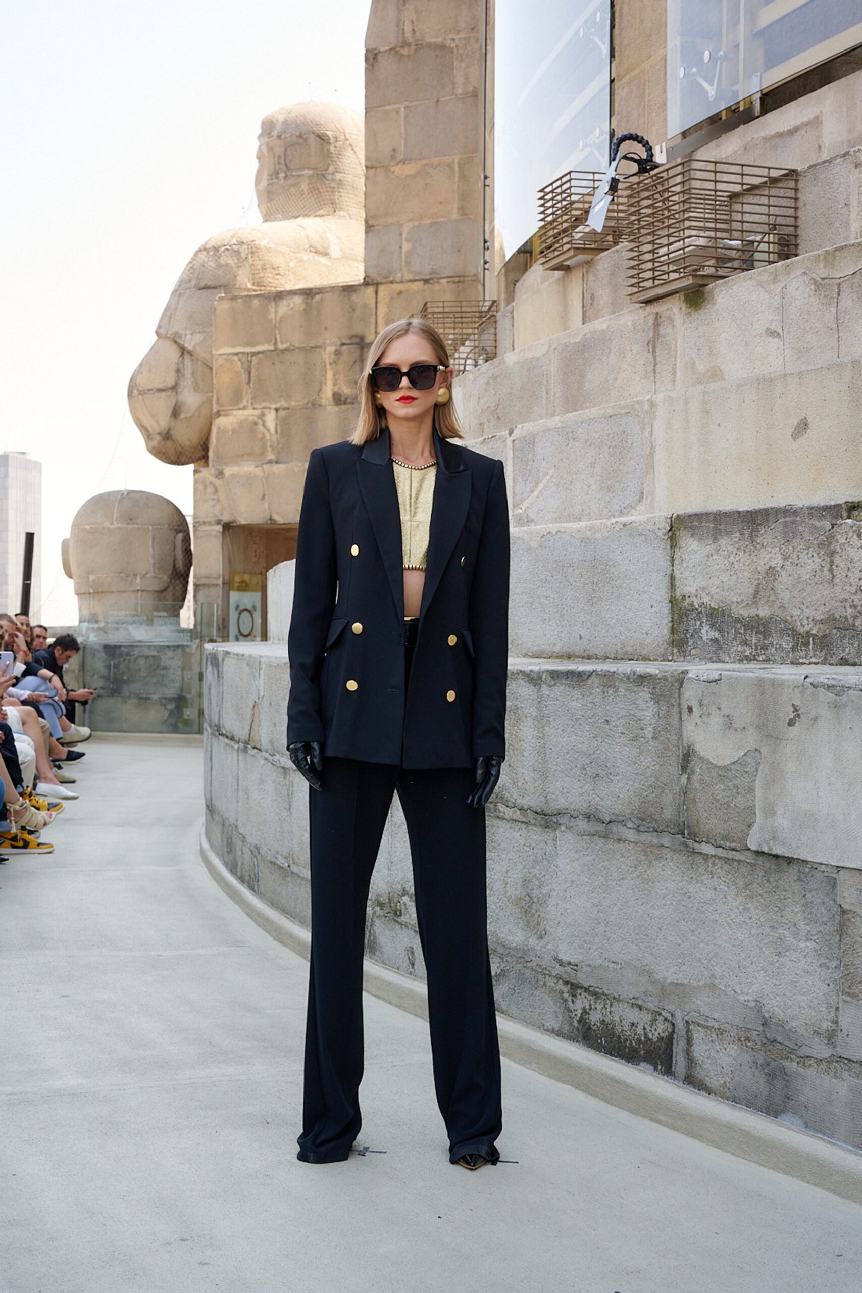 black tailored suit with gold top