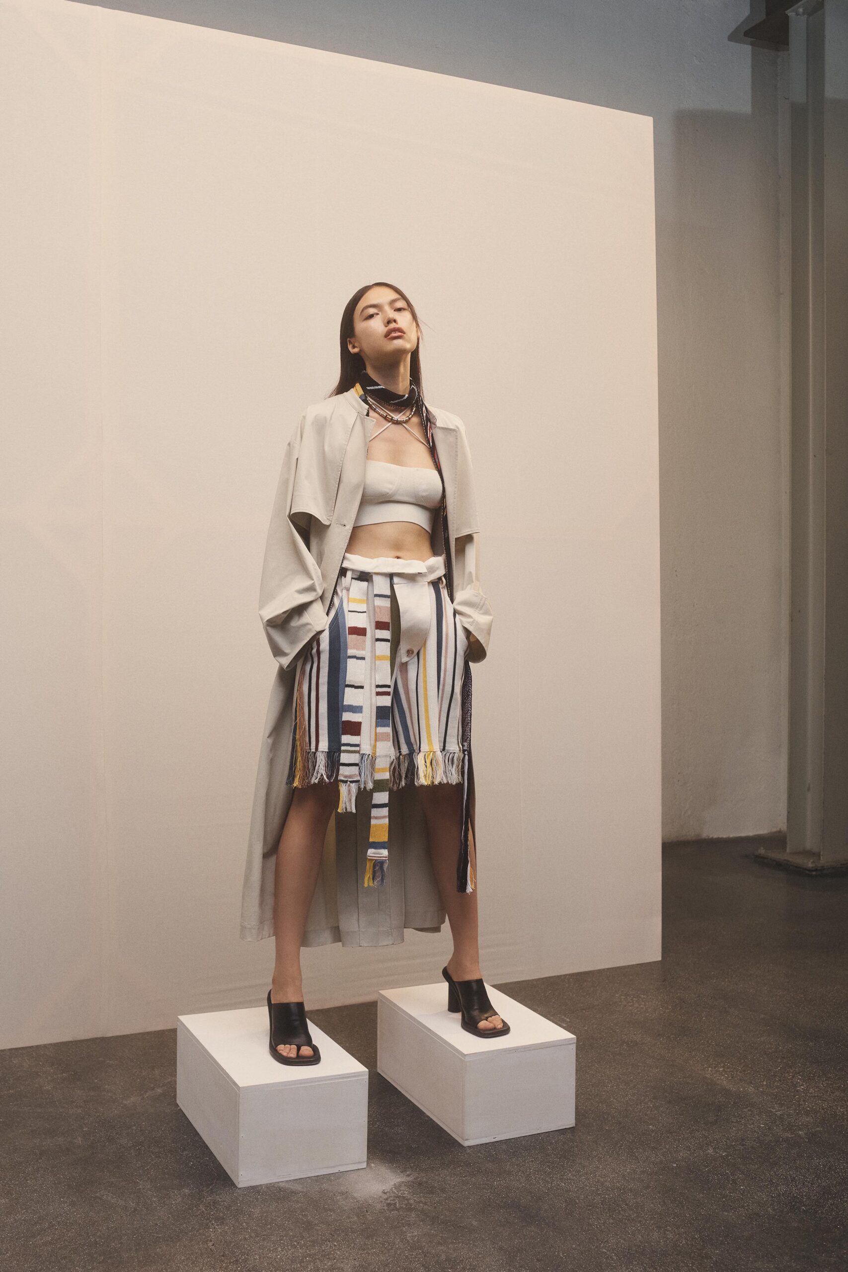 gray coat beige top multi skirt