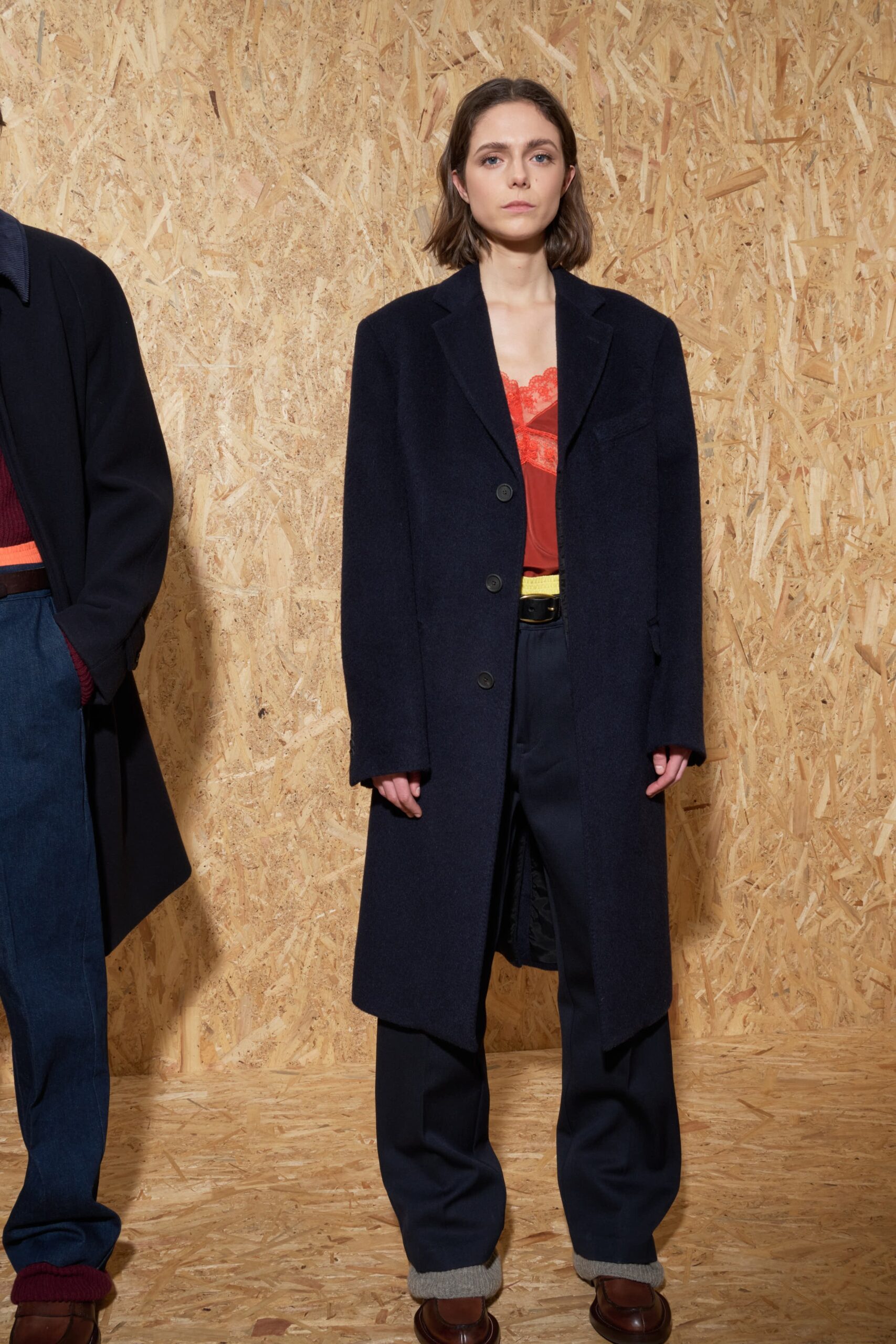 navy wool coat with red top