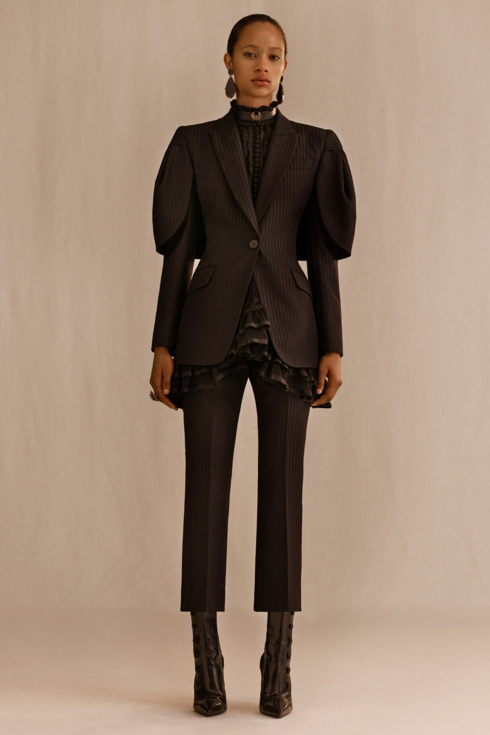 black wool long-sleeve collared tailored pleated buttoned suit