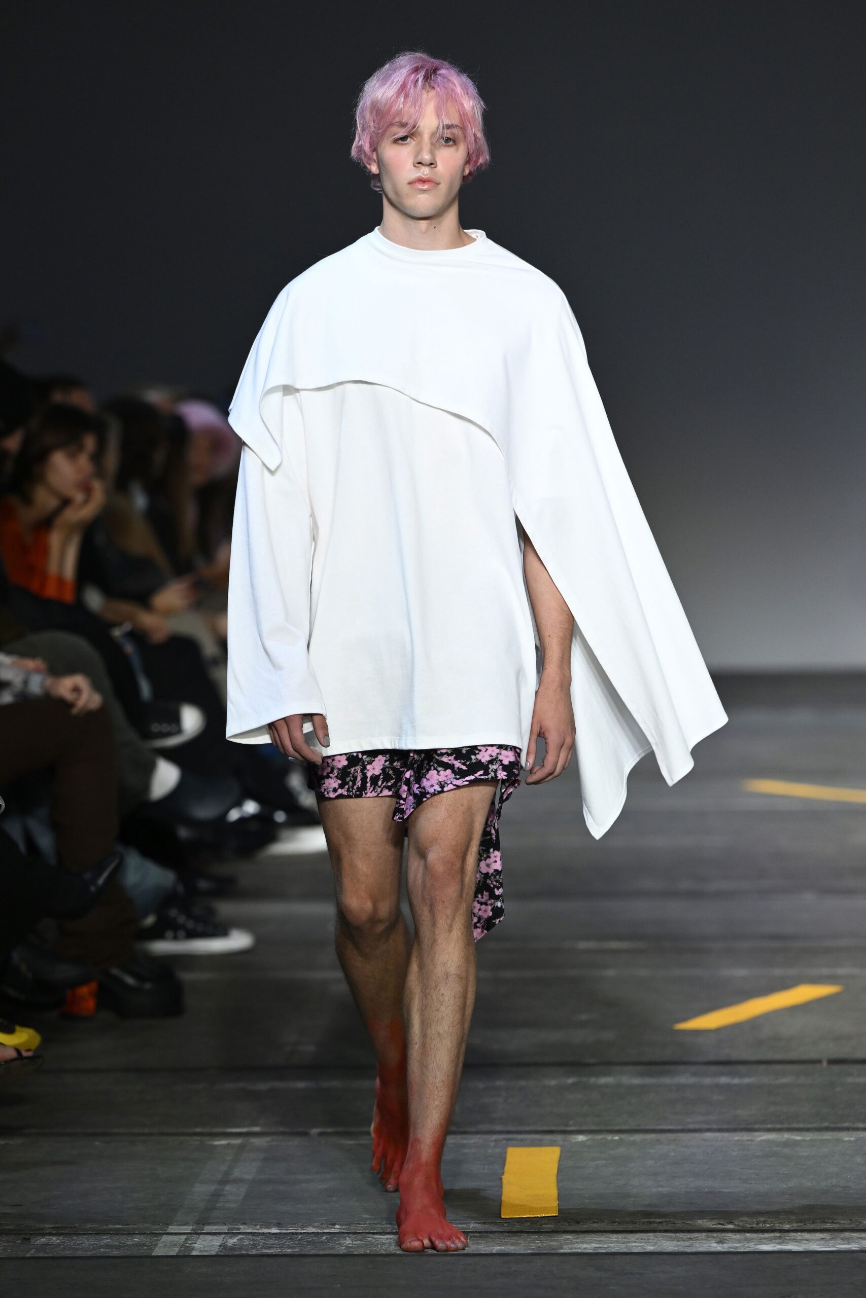 white asymmetric top with black pink shorts
