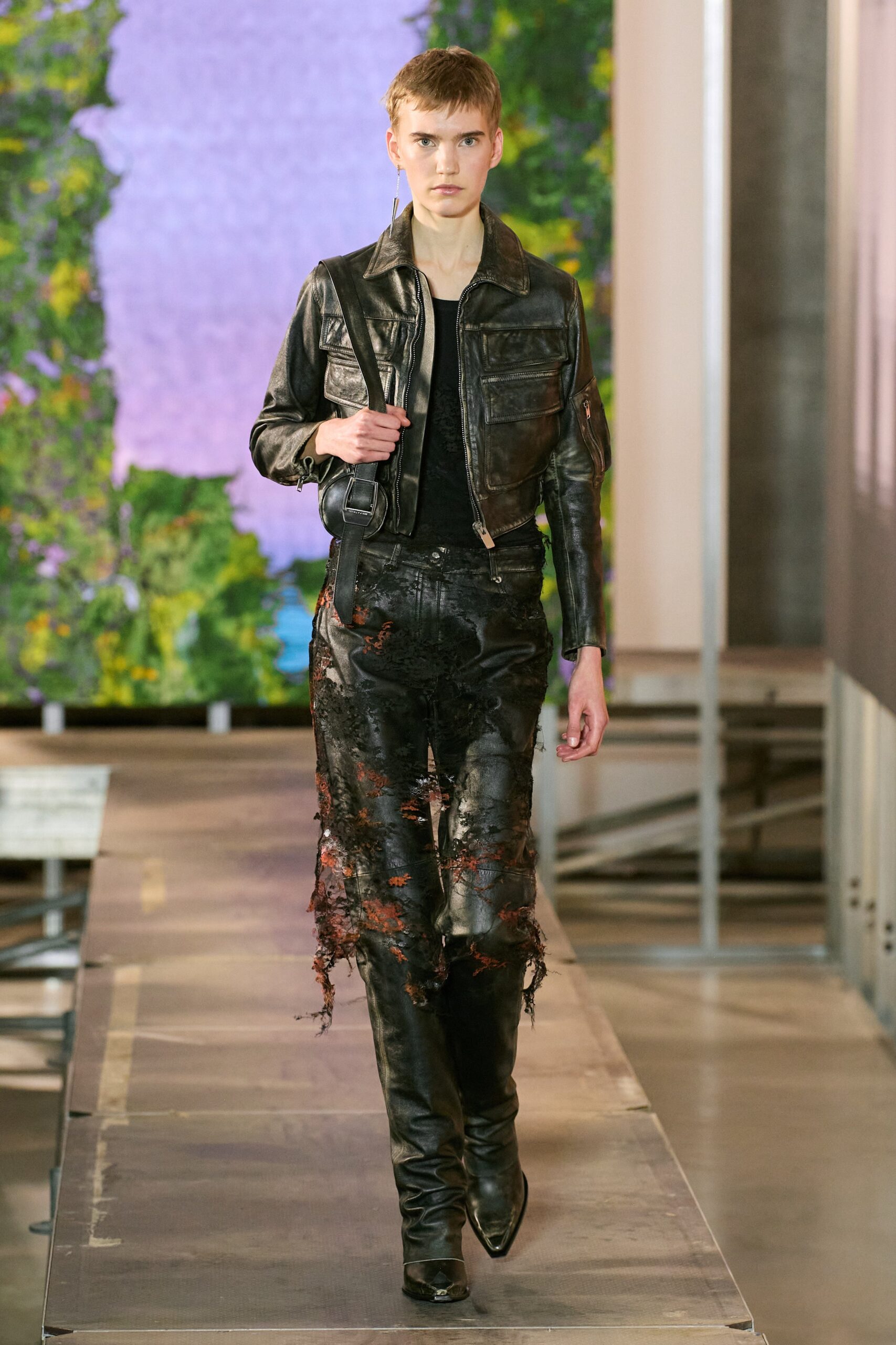 black leather jacket and distressed pants