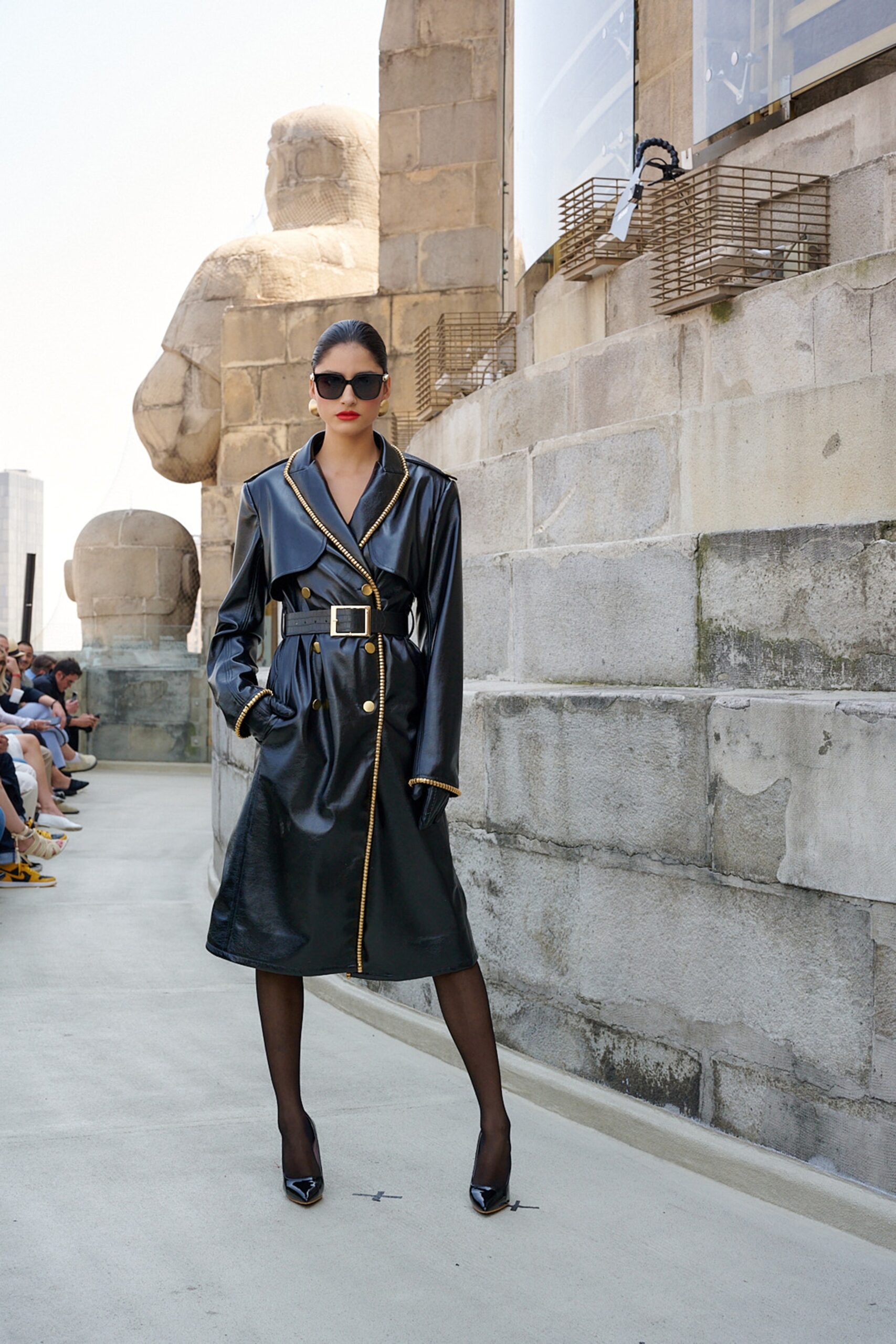 black leather long-sleeve collared fitted belted pockets coat