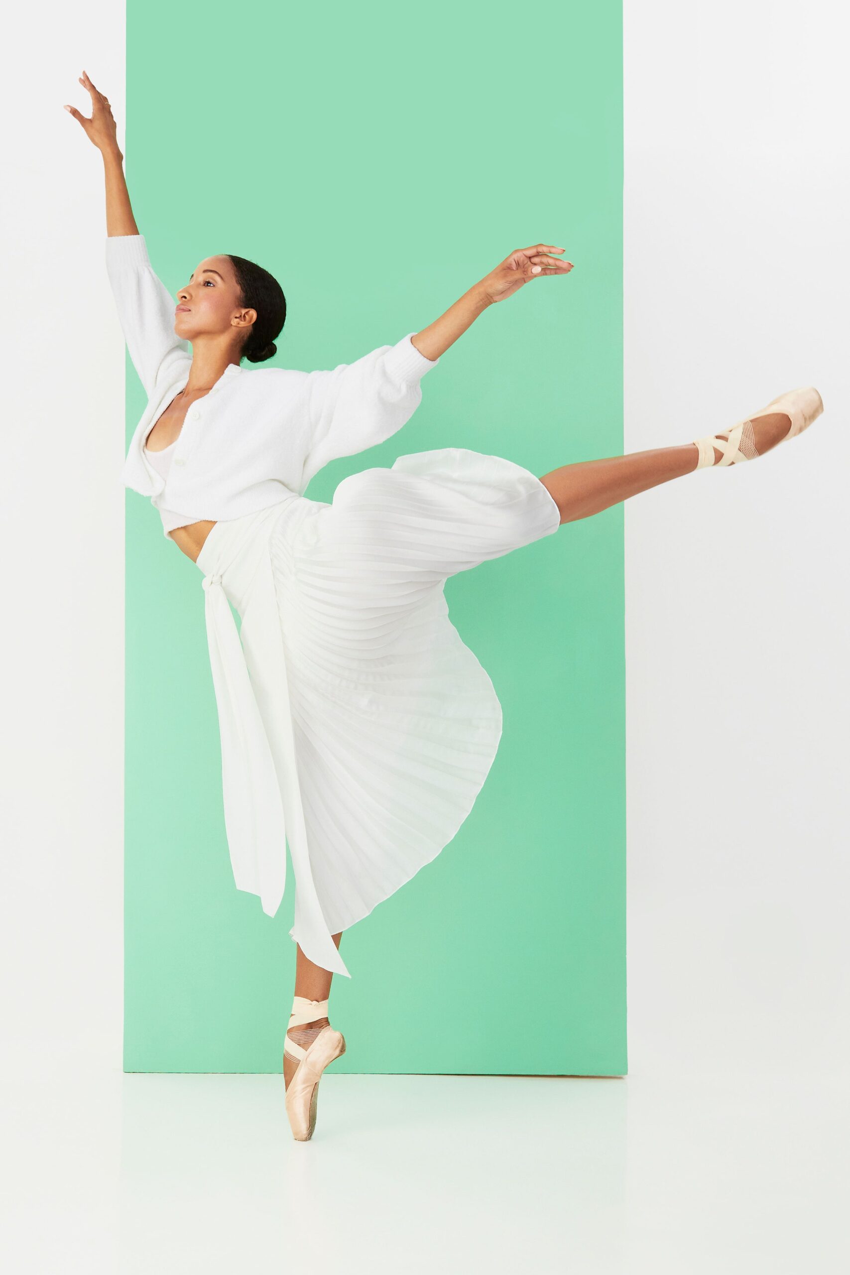 white relaxed top and pleated skirt
