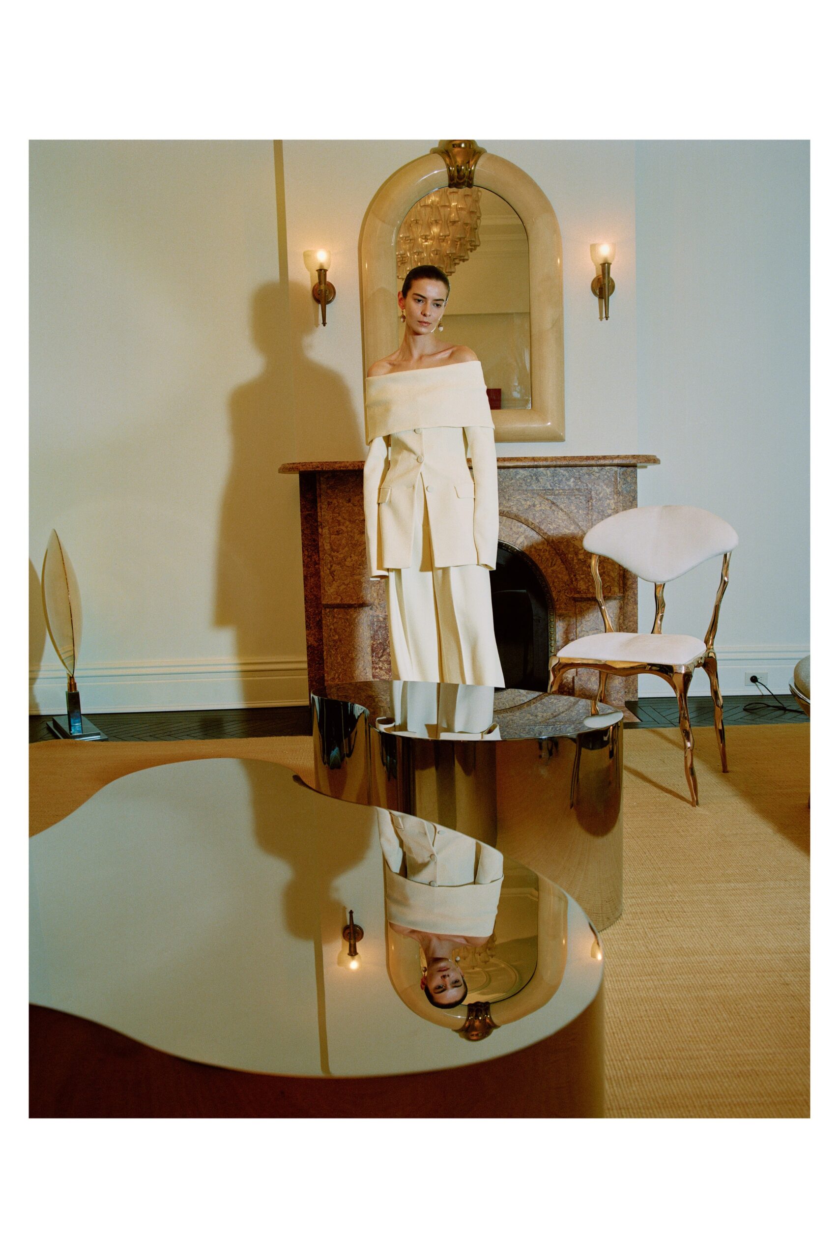 white off-shoulder blouse and beige tailored pants