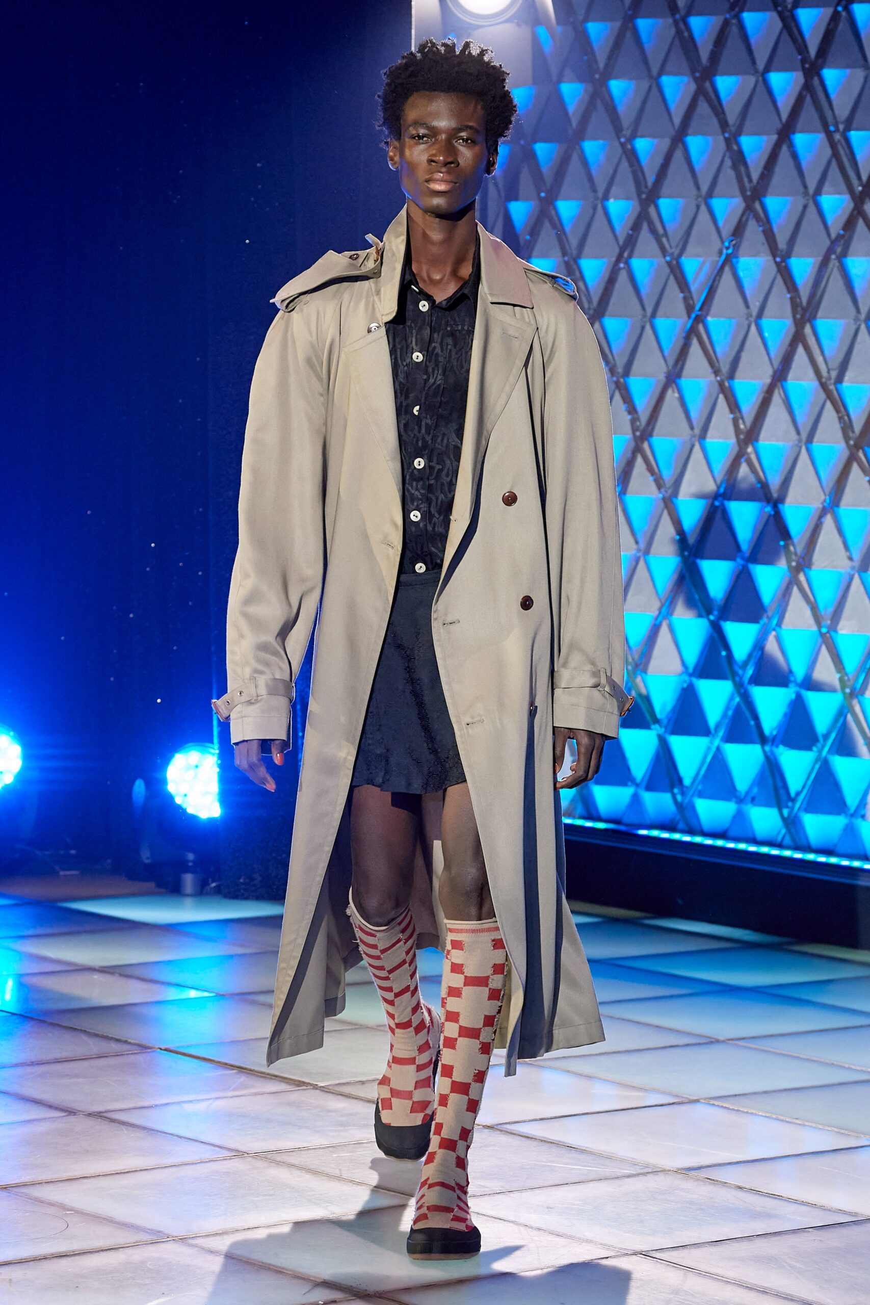 beige trench coat over black dress