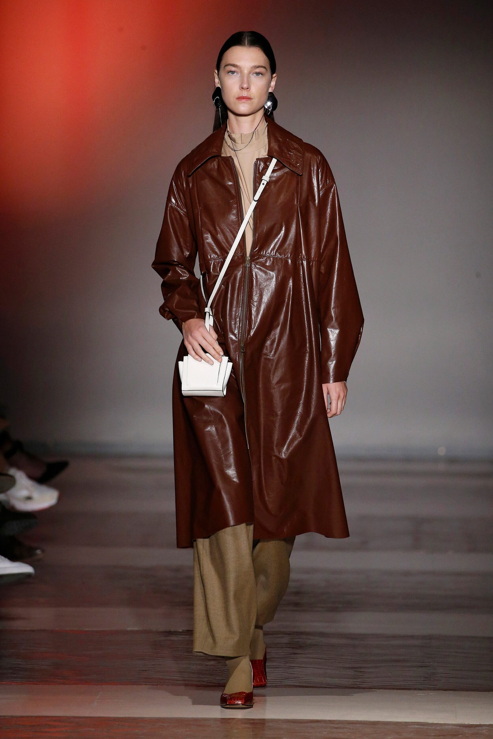 brown leather coat with beige pants