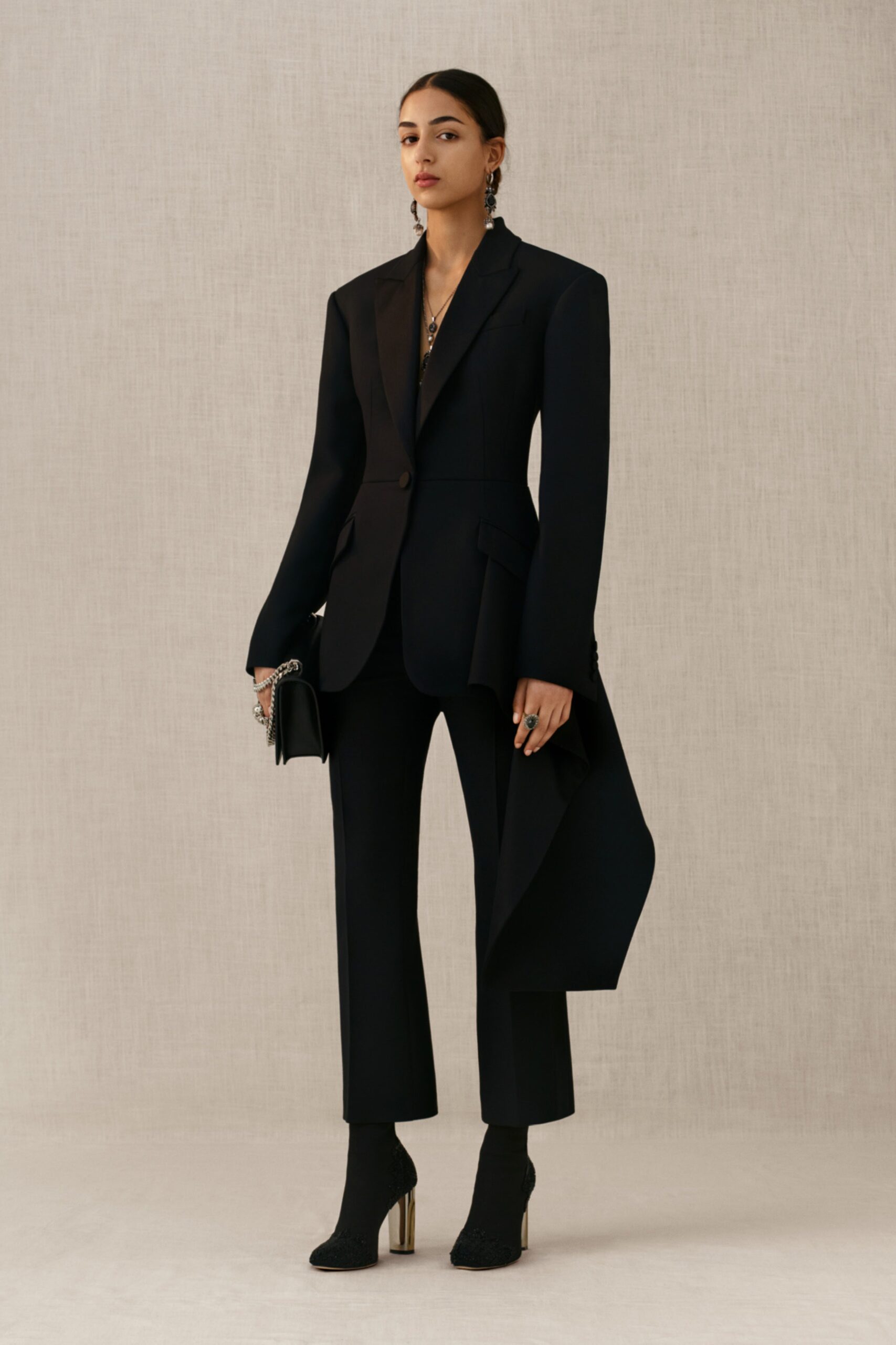 black tailored suit with asymmetric detail