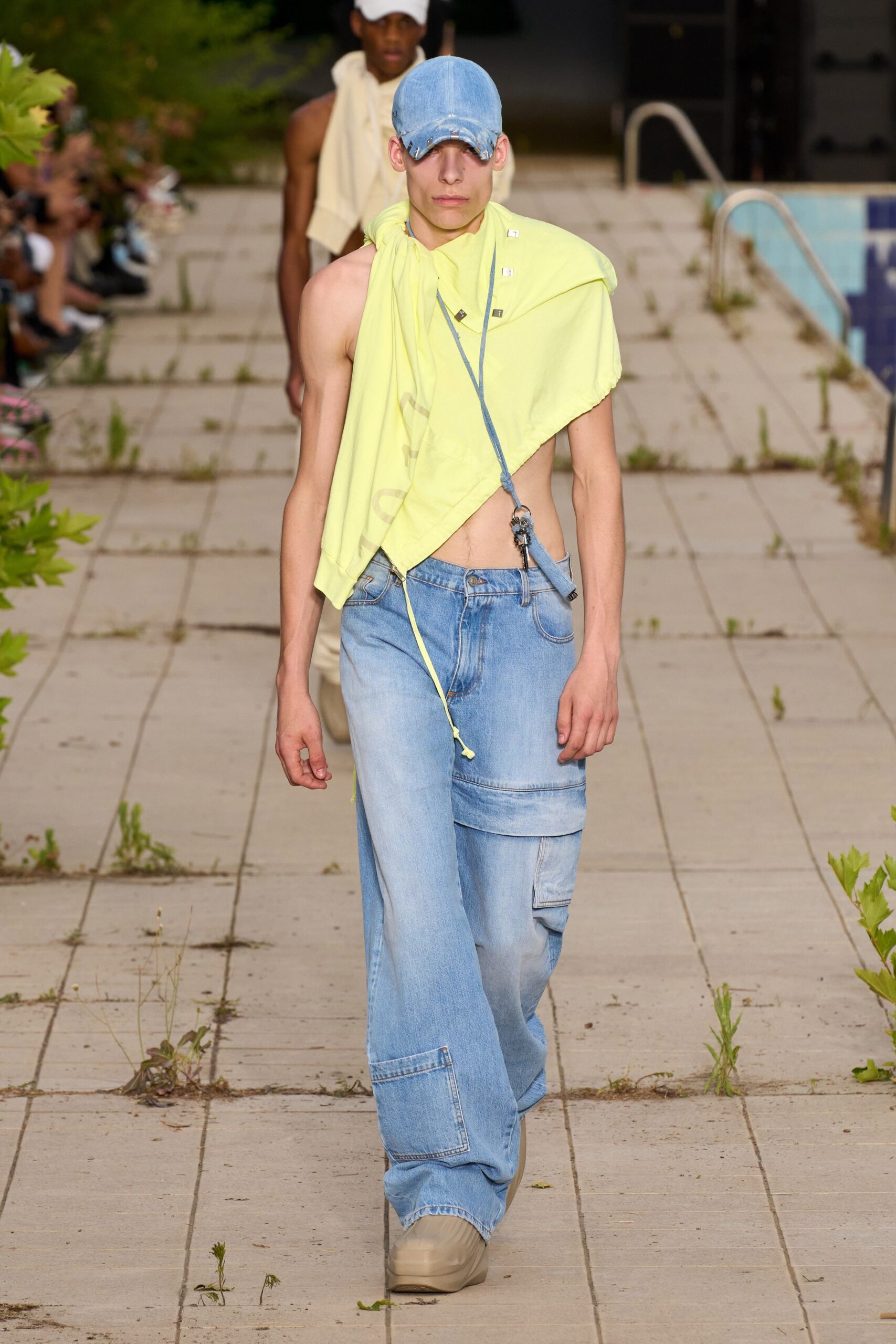 yellow tank-top and blue cargo pants