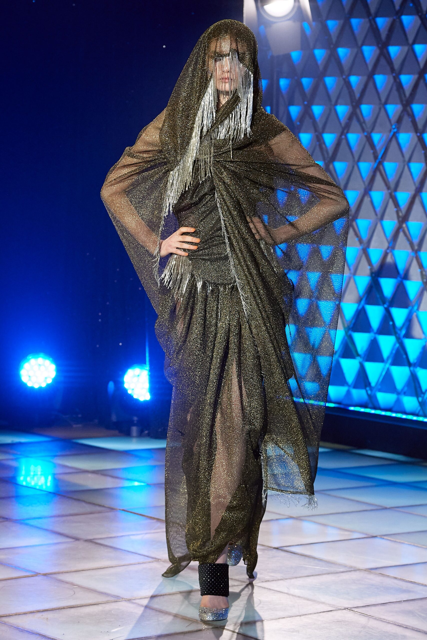 black and gold sheer gown with cape