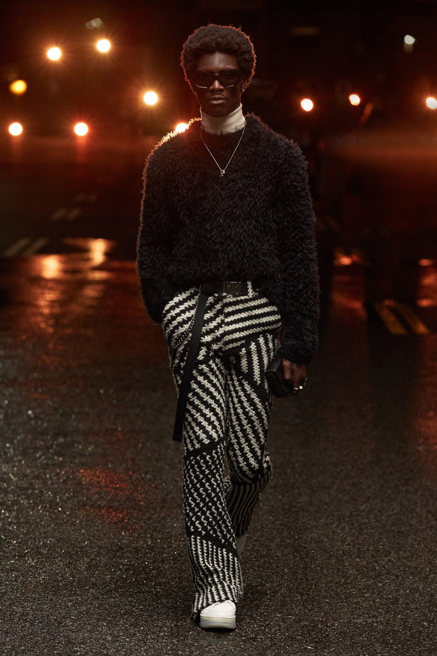 black wool relaxed sweater and checked pants