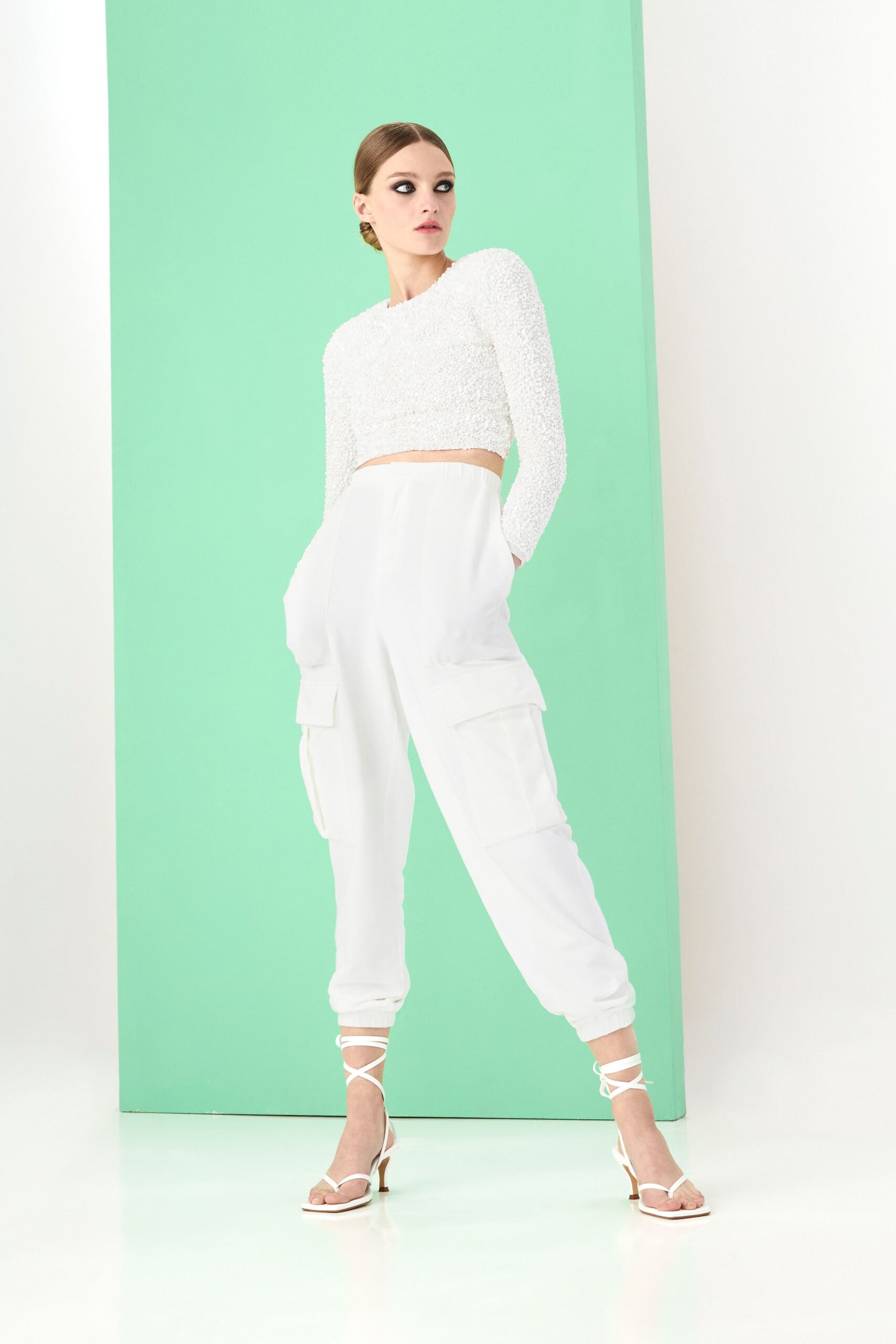 white cropped top and cargo pants