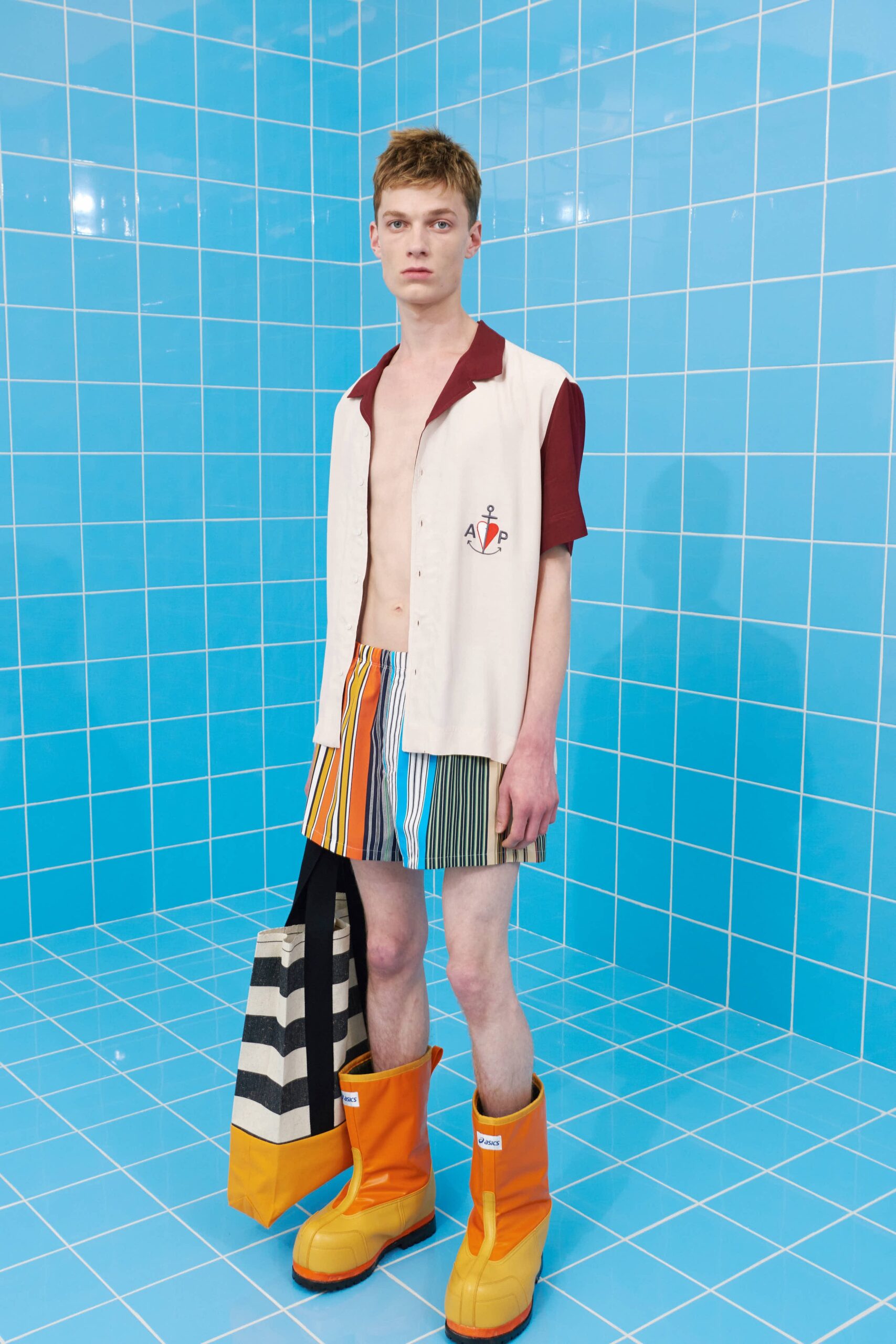 beige collared shirt with striped shorts