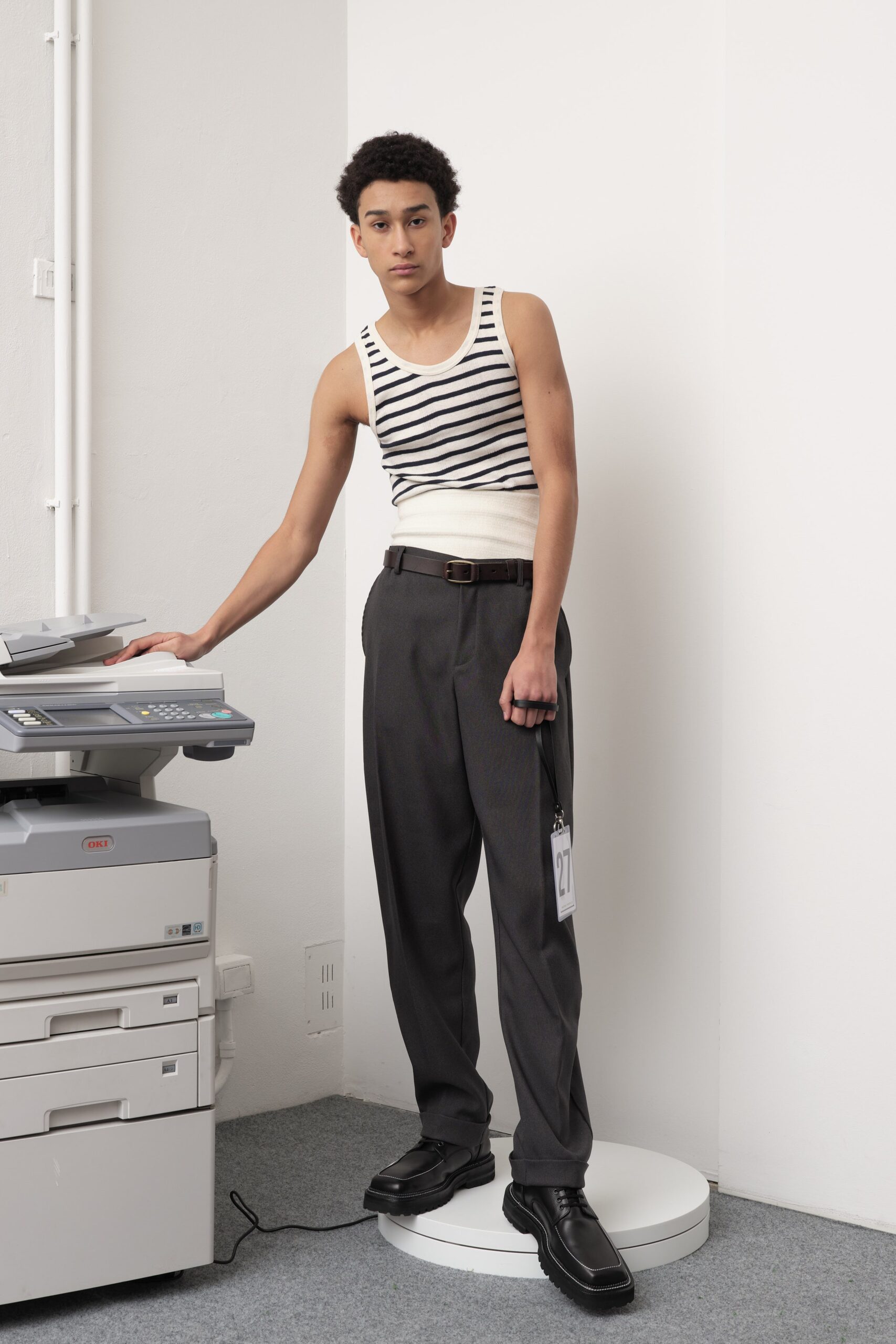 fitted striped tank-top and relaxed gray pants
