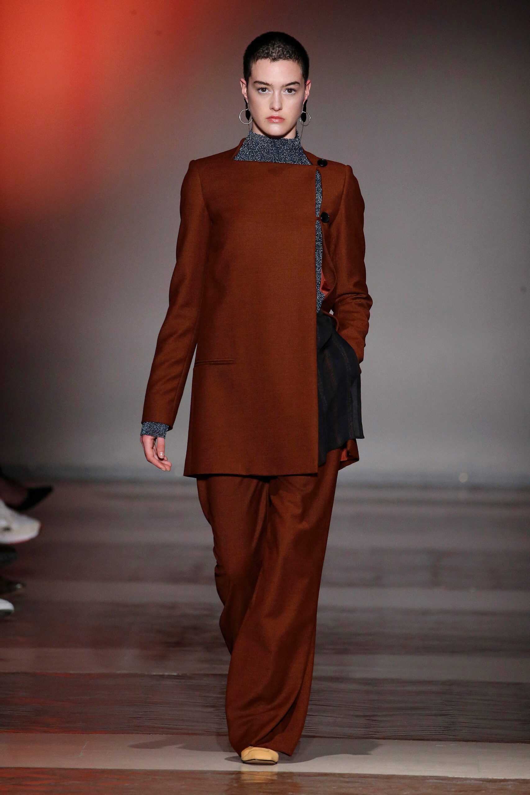 brown tailored suit with blue top