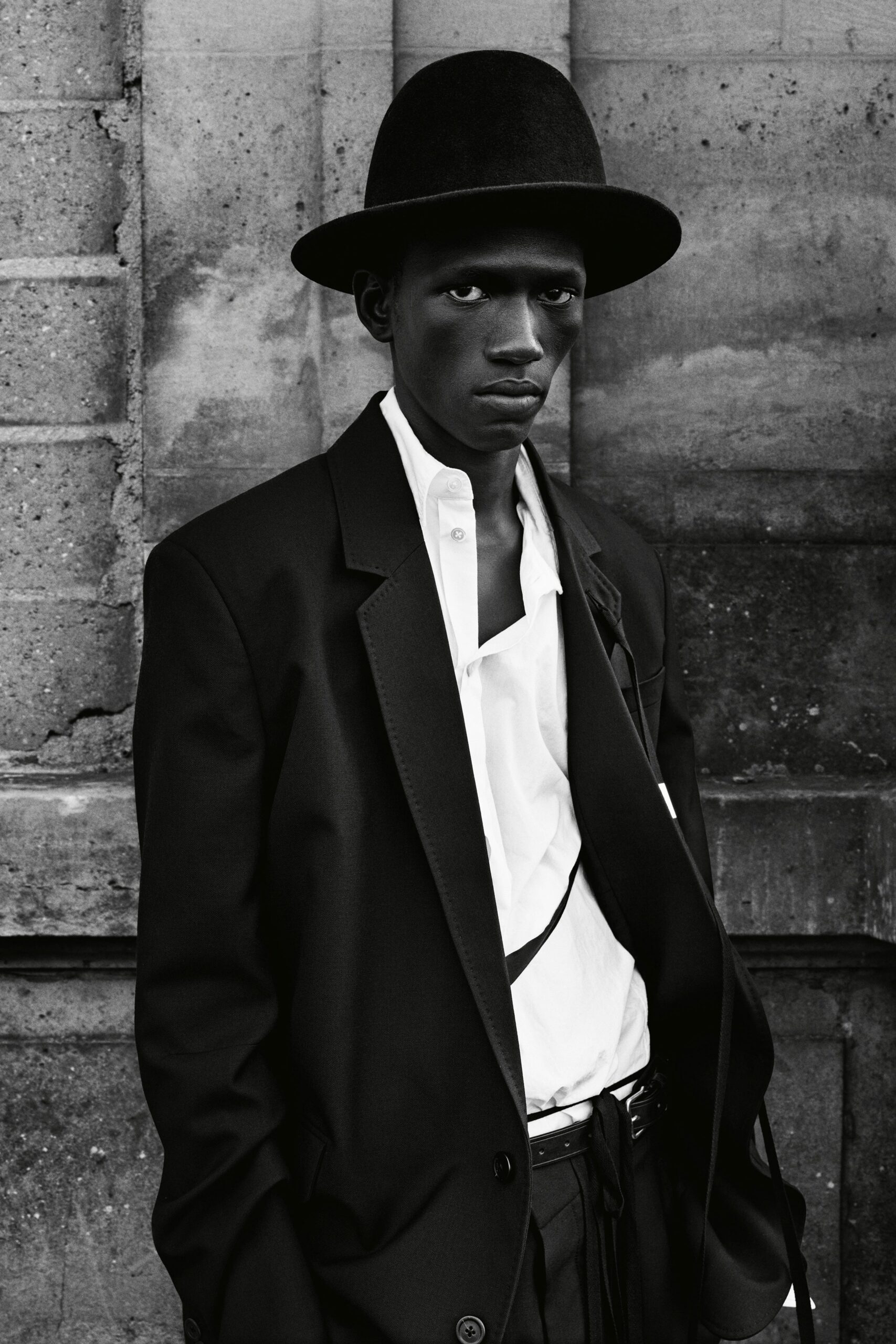 black blazer white shirt hat