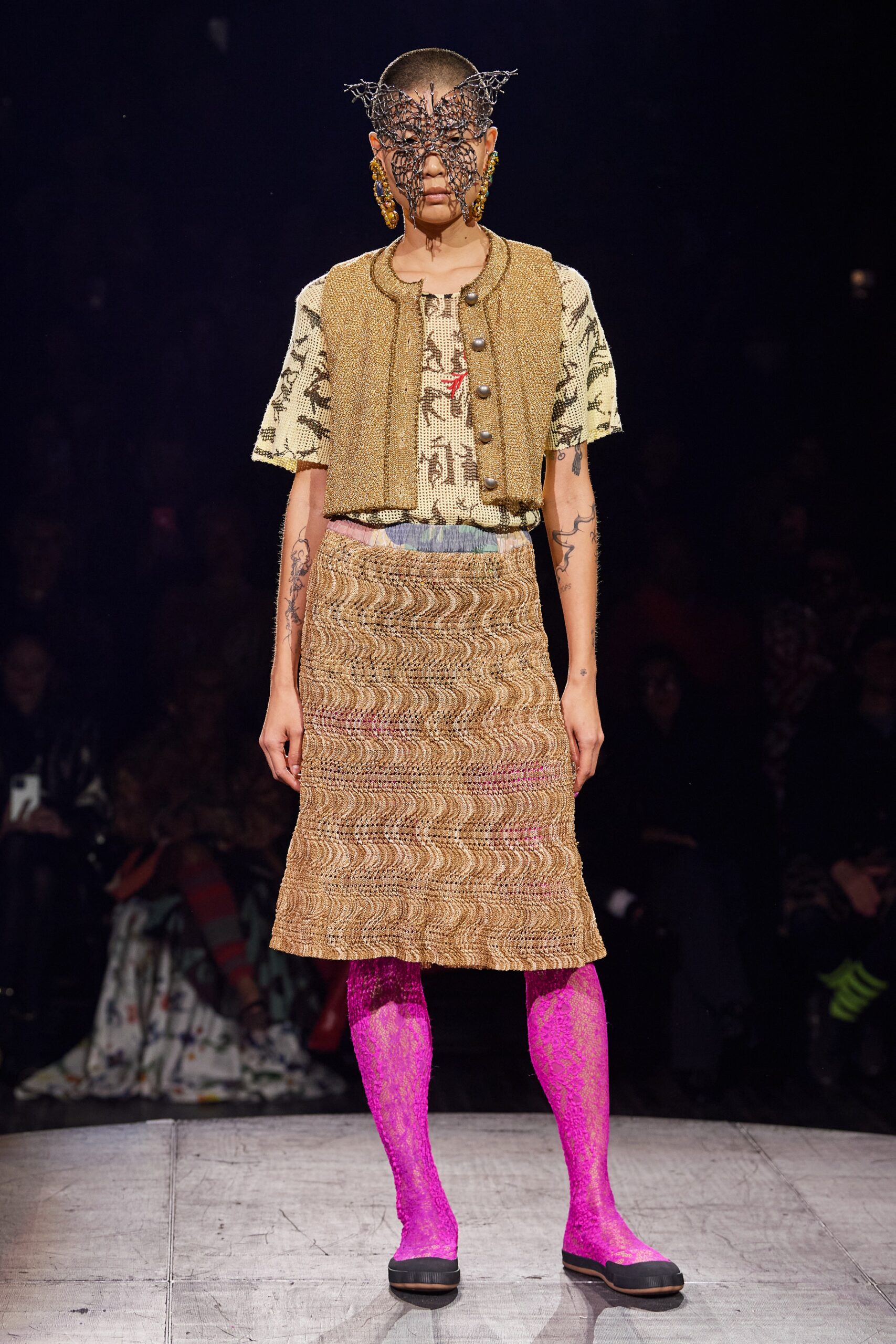 beige embroidered top with brown vest