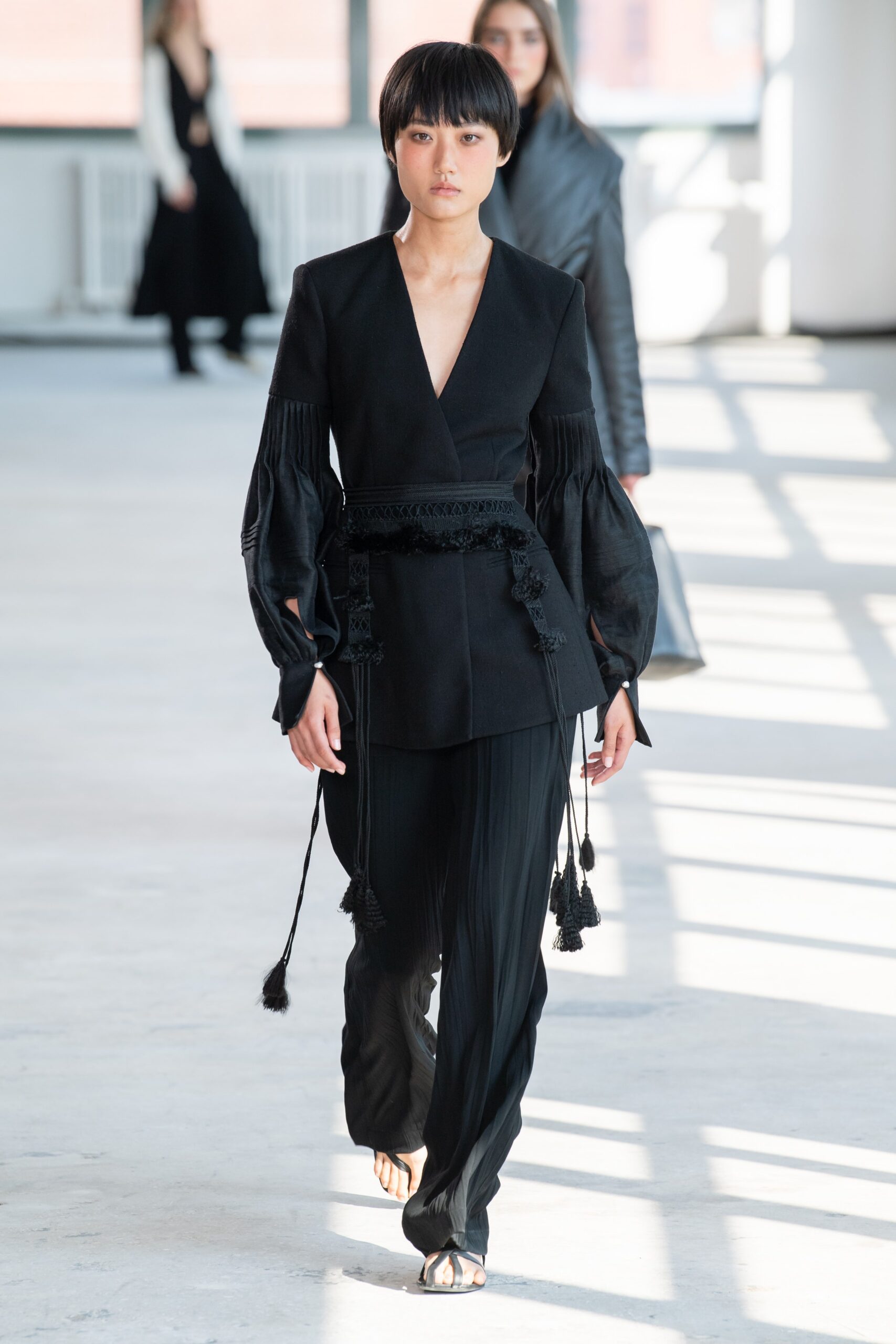 black silk fitted blazer and relaxed pants