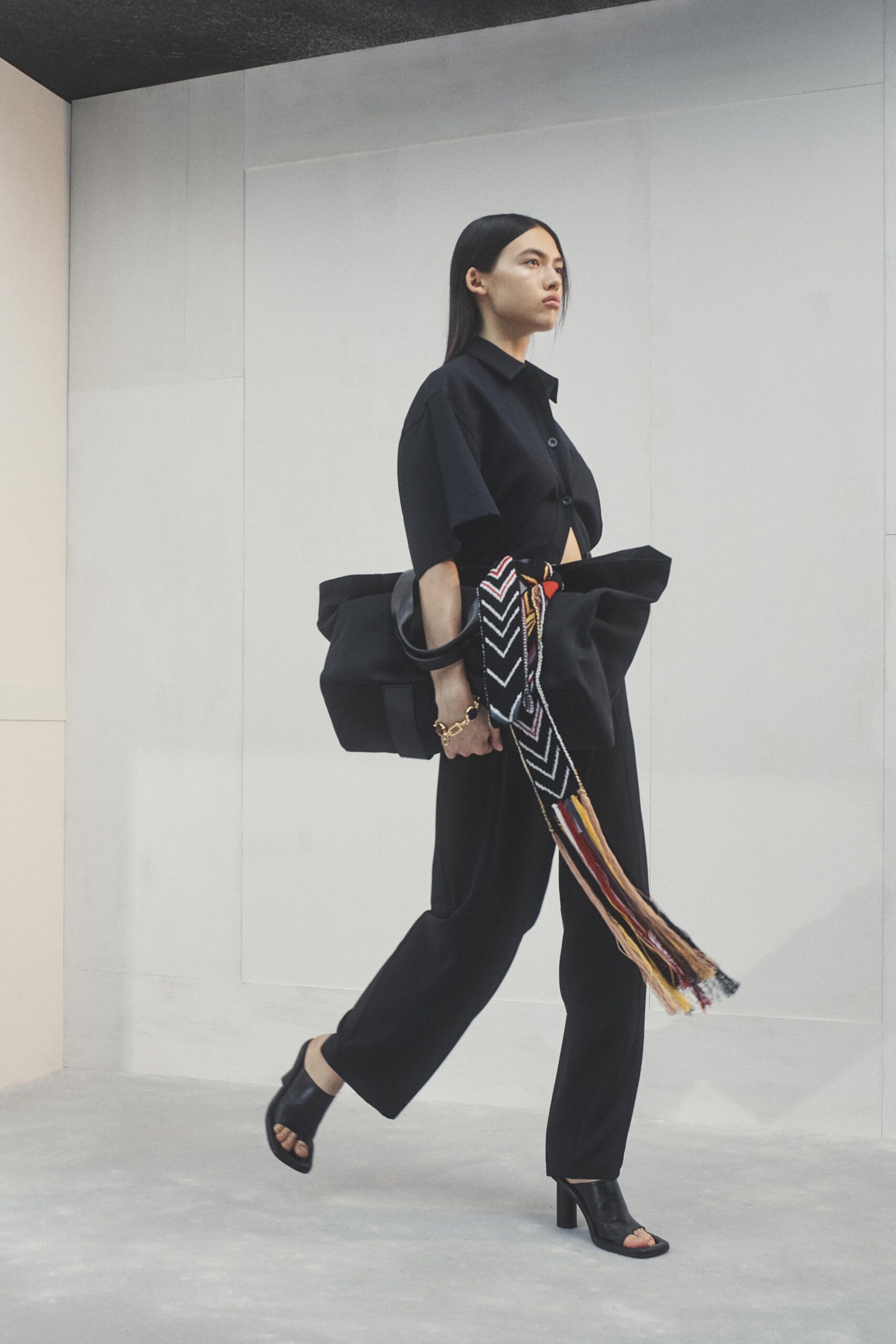 black relaxed top and tailored pants