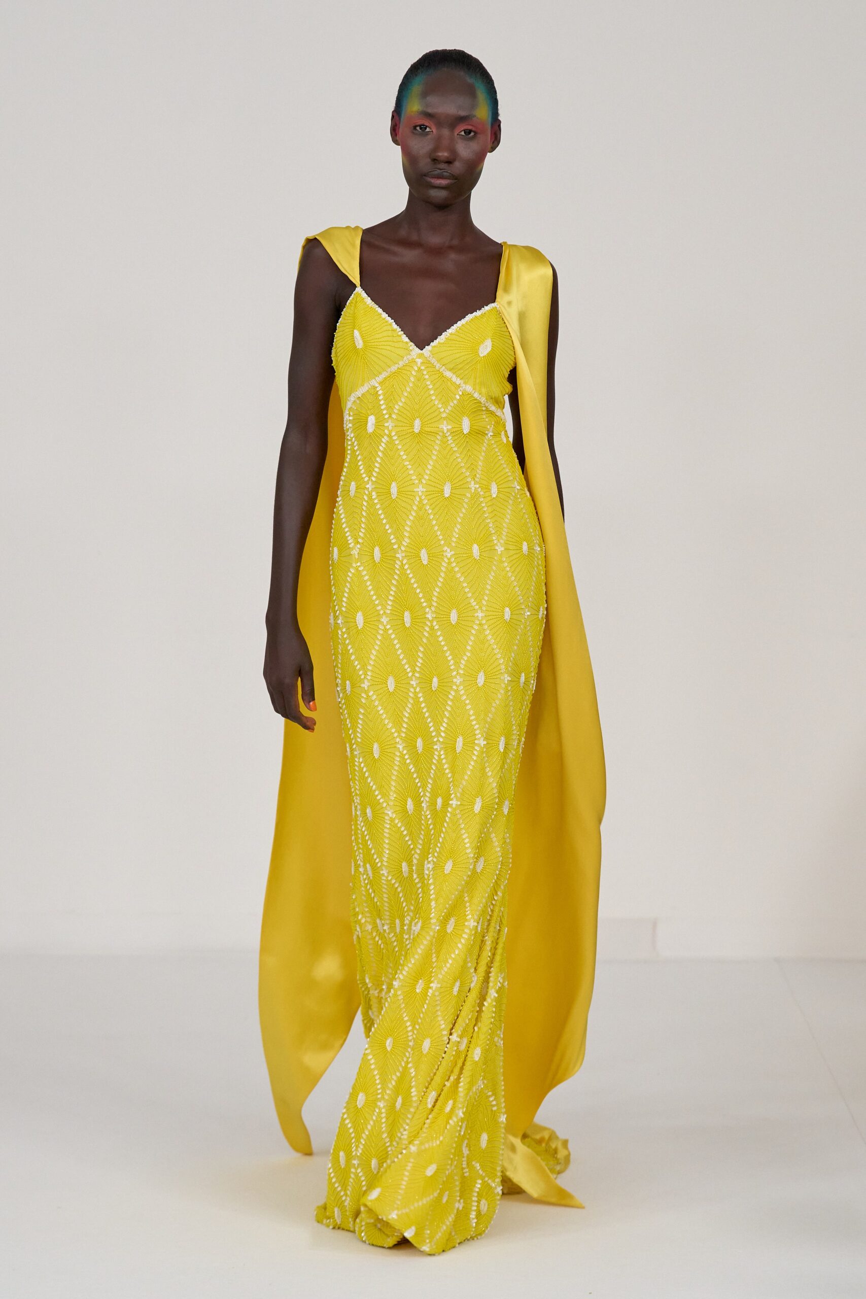yellow silk sleeveless v-neck fitted beaded draped gown