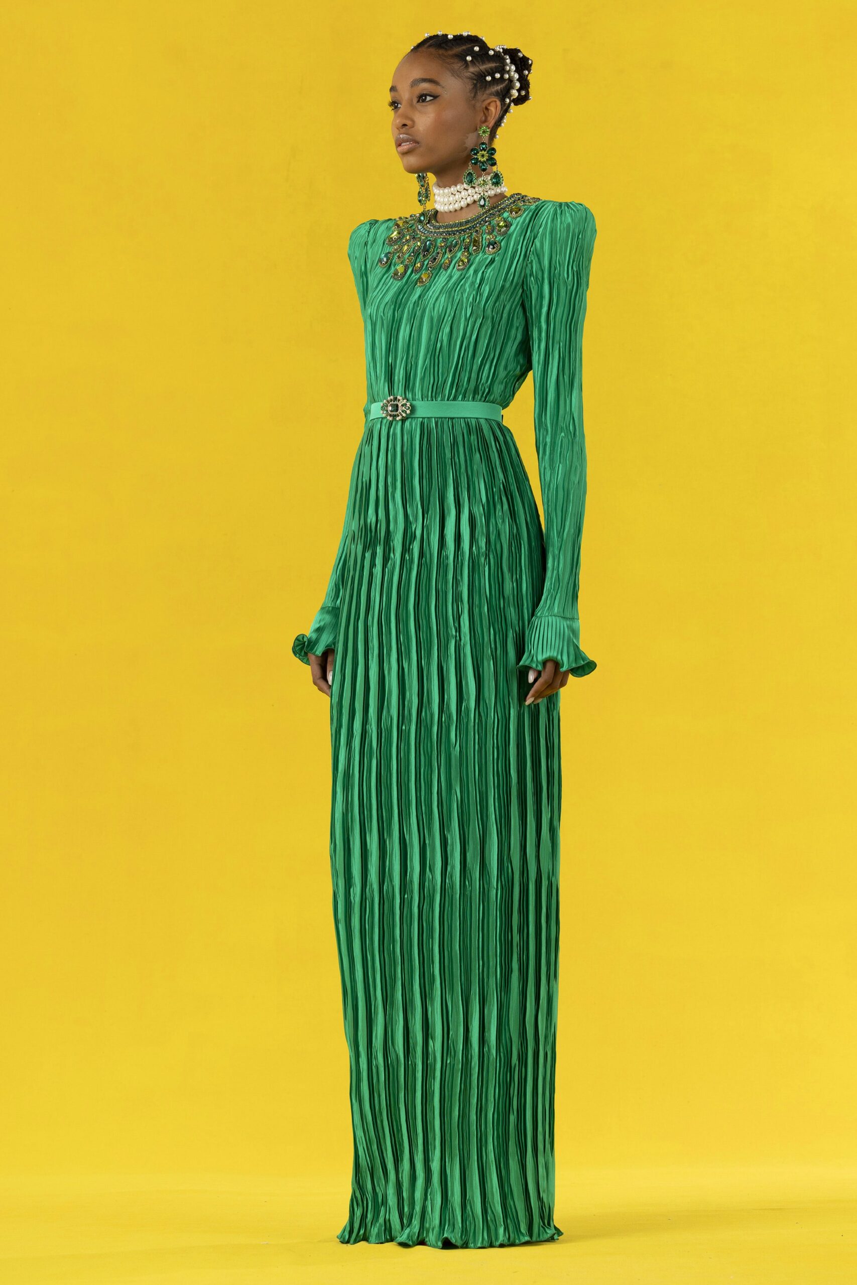 green pleated long-sleeve gown
