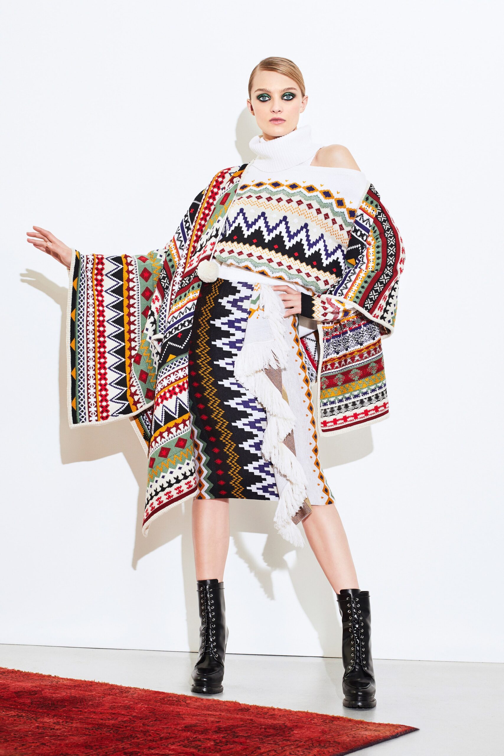 multi-colored poncho with fitted skirt
