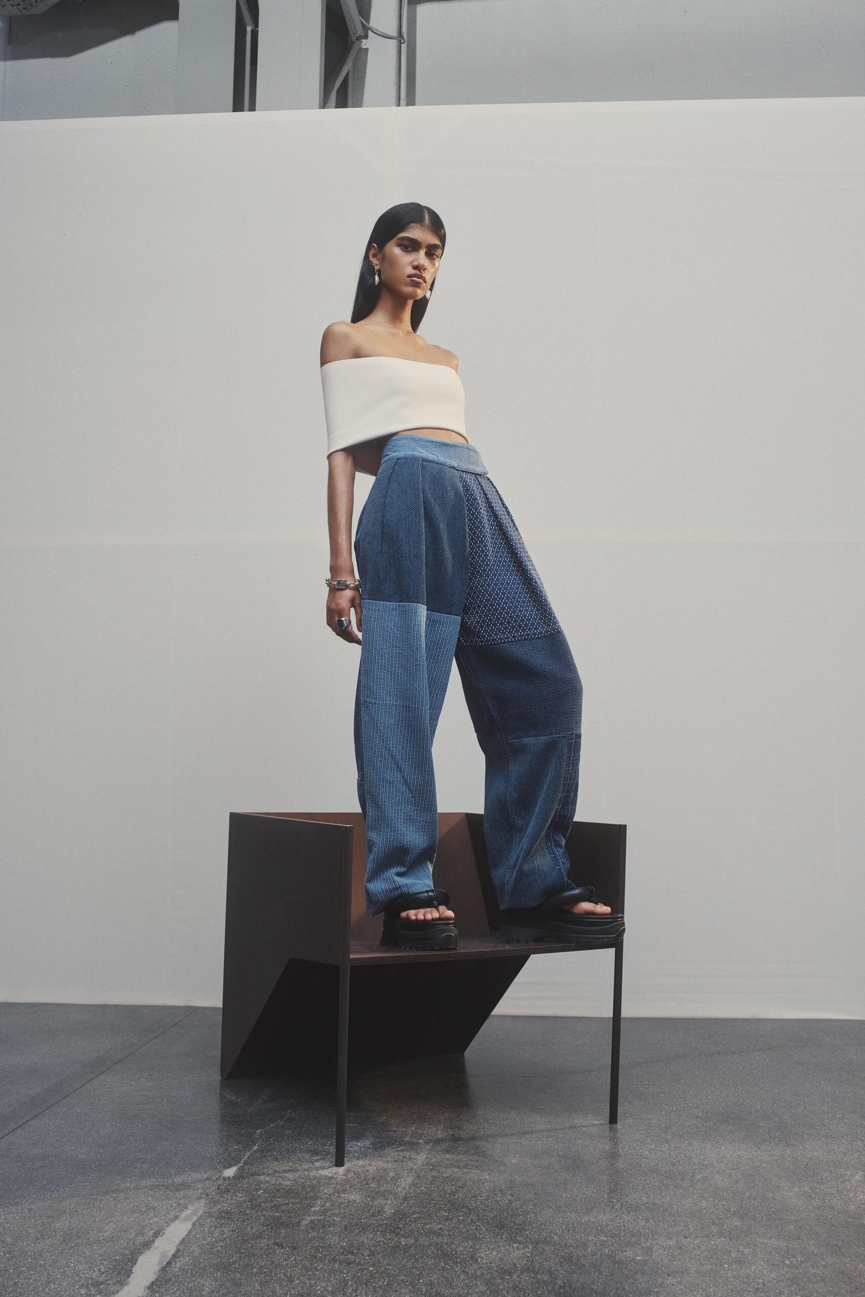 white off-shoulder top and blue wide-leg pants