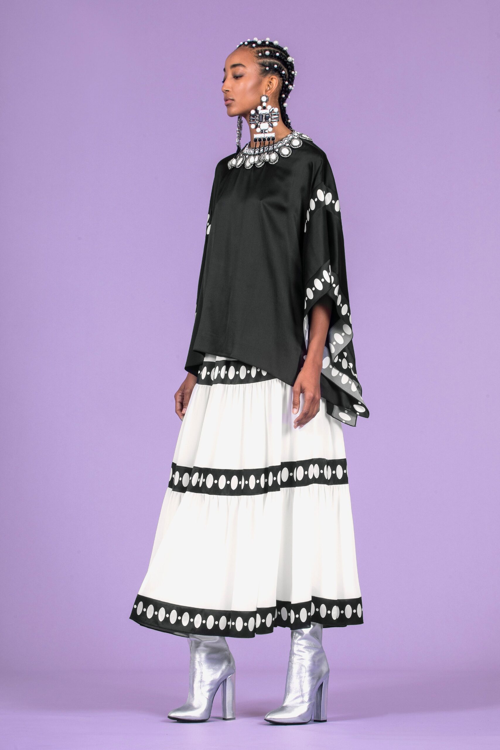 black silk top with white pleated skirt