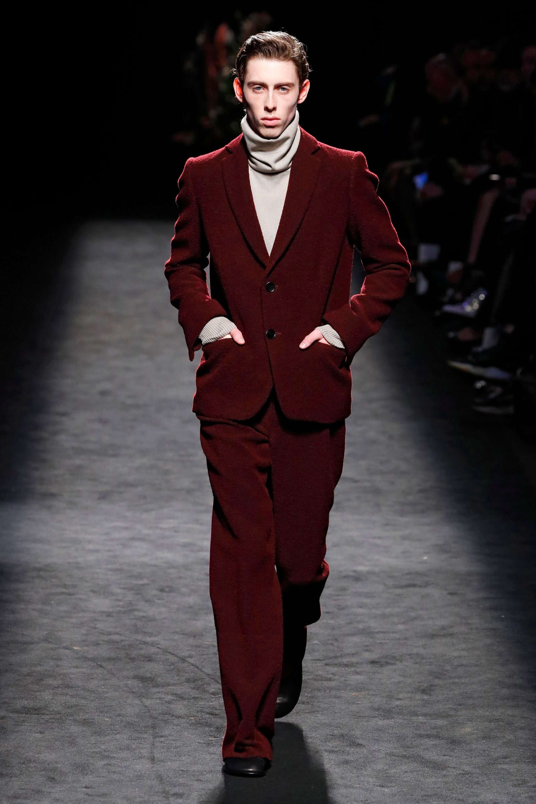 maroon tailored suit with beige turtleneck