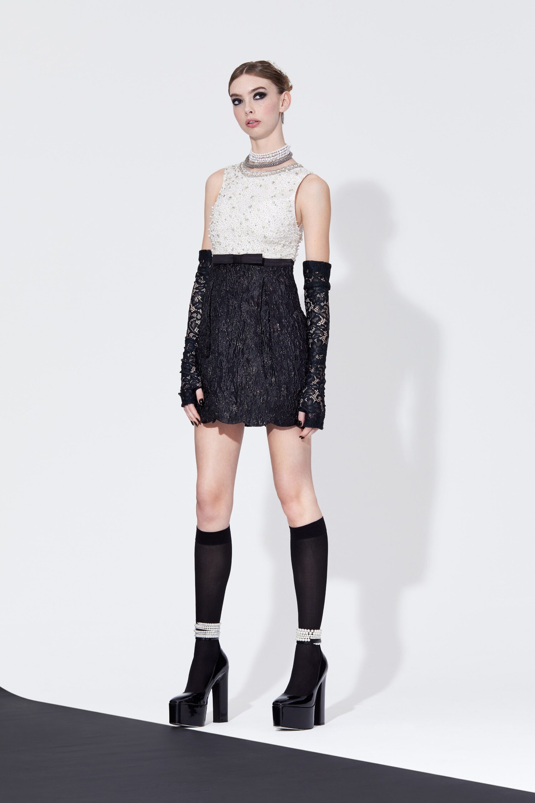 black lace sleeveless high-neck fitted pleated layered dress
