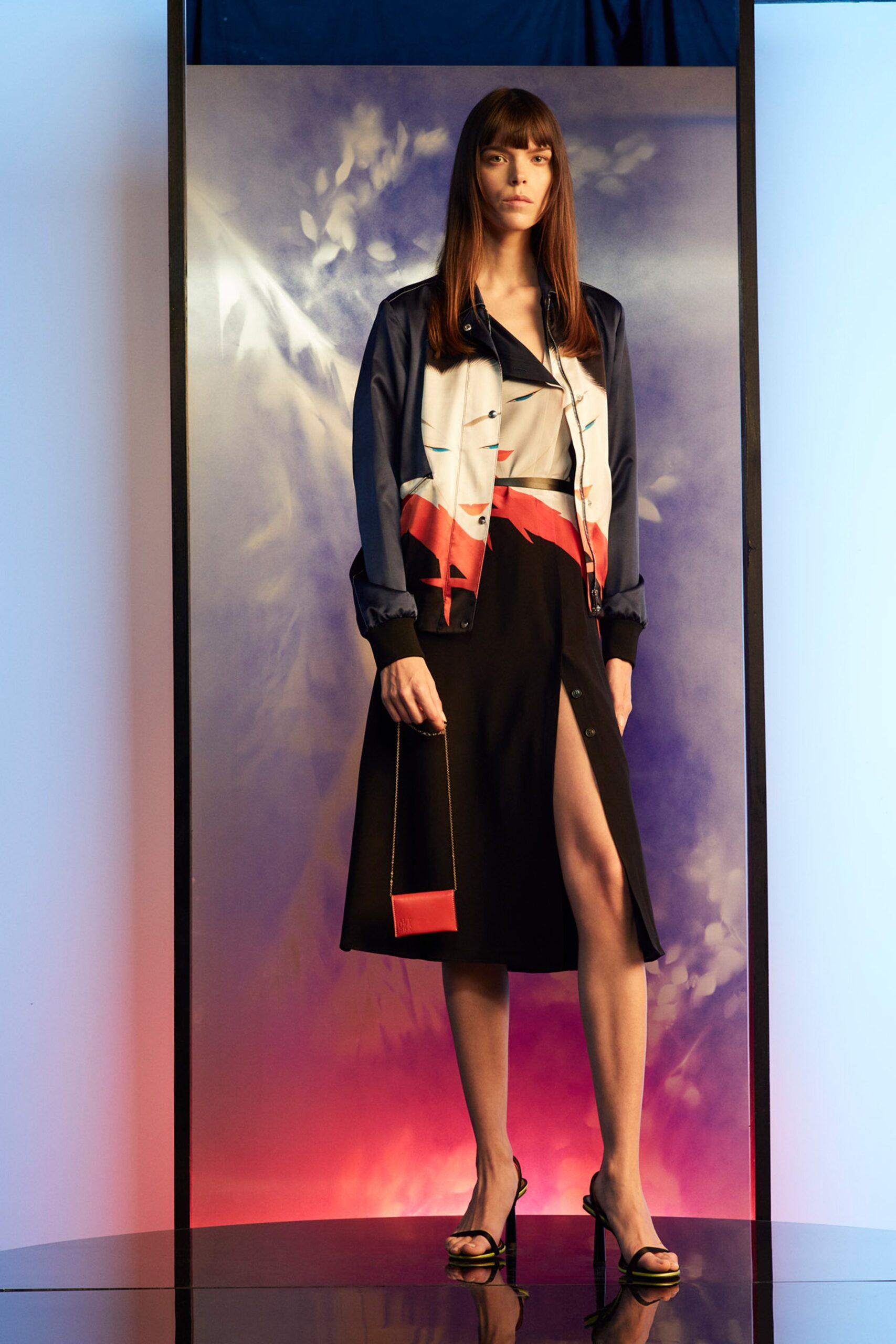 fitted blue silk jacket and black midi skirt