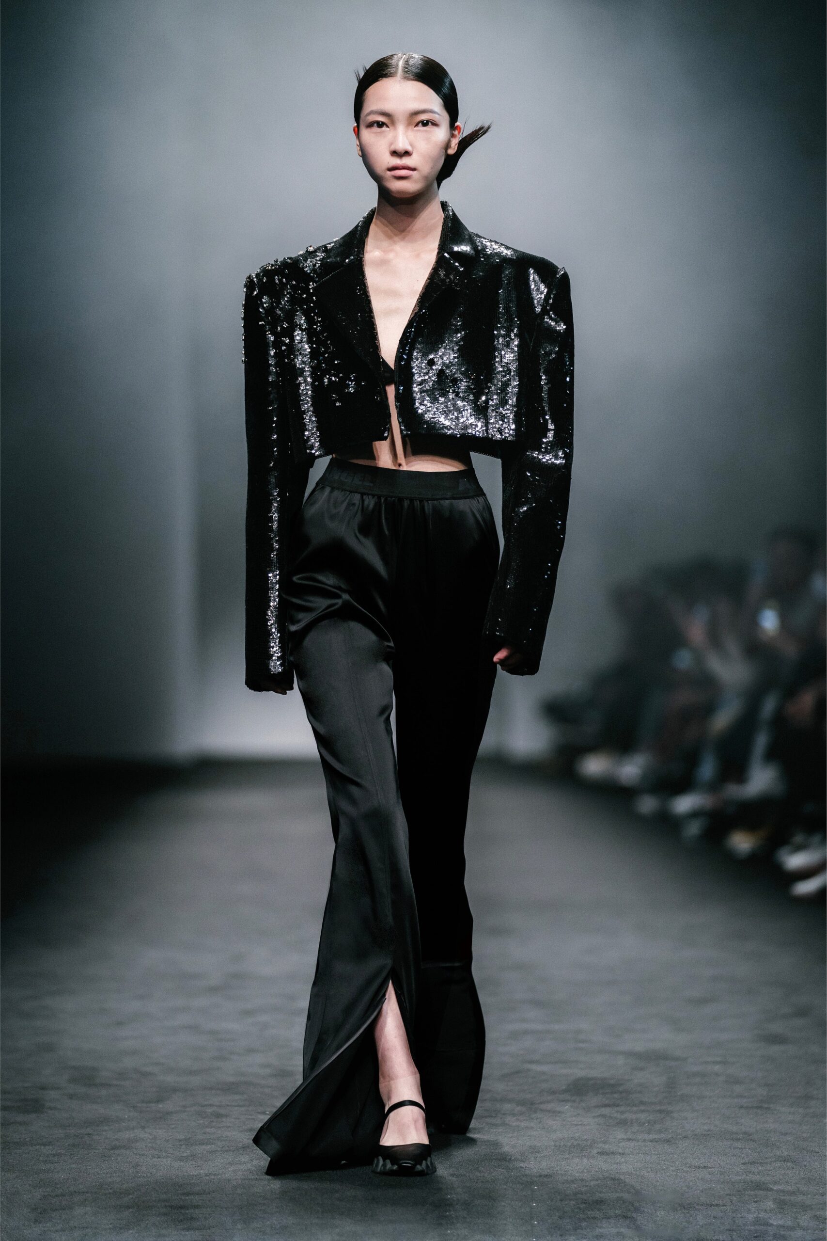 black sequin cropped jacket and silk pants
